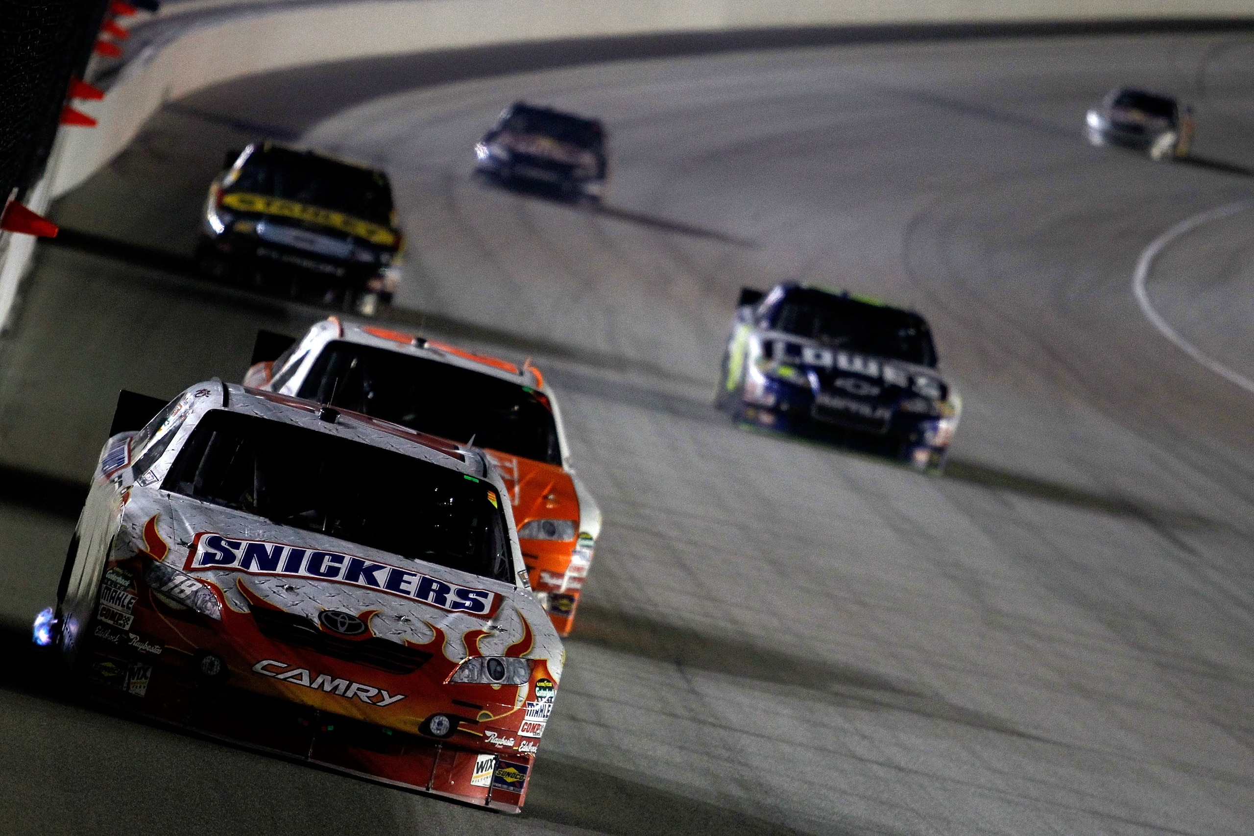 JOLIET, IL - JULY 10:  Kyle Busch, driver of the #18 Snickers Toyota, drives during the NASCAR Sprint Cup Series LIFELOCK.COM 400 at the Chicagoland Speedway on July 10, 2010 in Joliet, Illinois.  (Photo by Todd Warshaw/Getty Images for NASCAR)