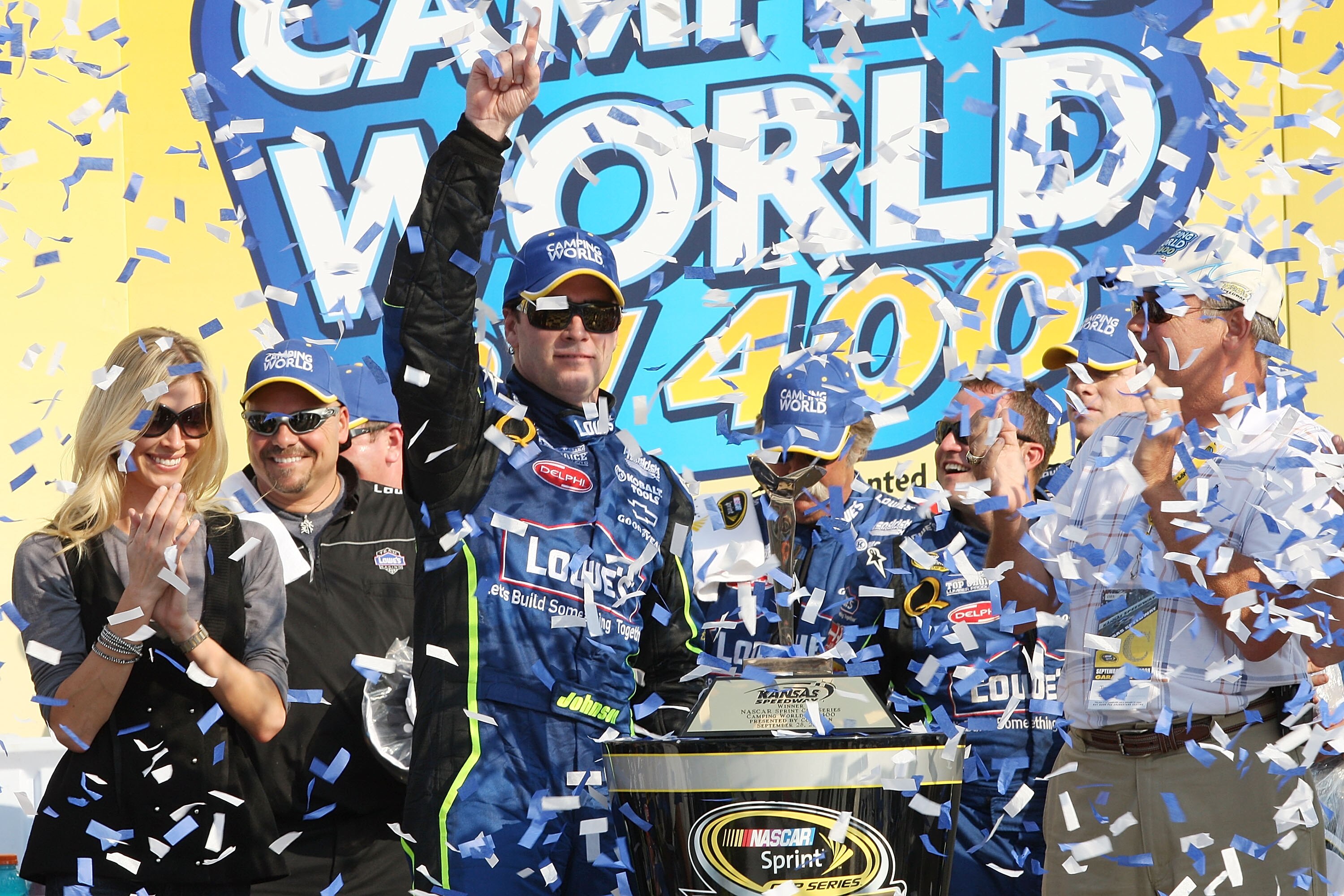 KANSAS CITY, KS - SEPTEMBER 28:  Jimmie Johnson driver of the #48 Lowe's Chevrolet celebrates after winning the NASCAR Sprint Cup Series Camping World RV 400 at Kansas Speedway on September 28, 2008 in Kansas City, Kansas.  (Photo by John Harrelson/Getty 