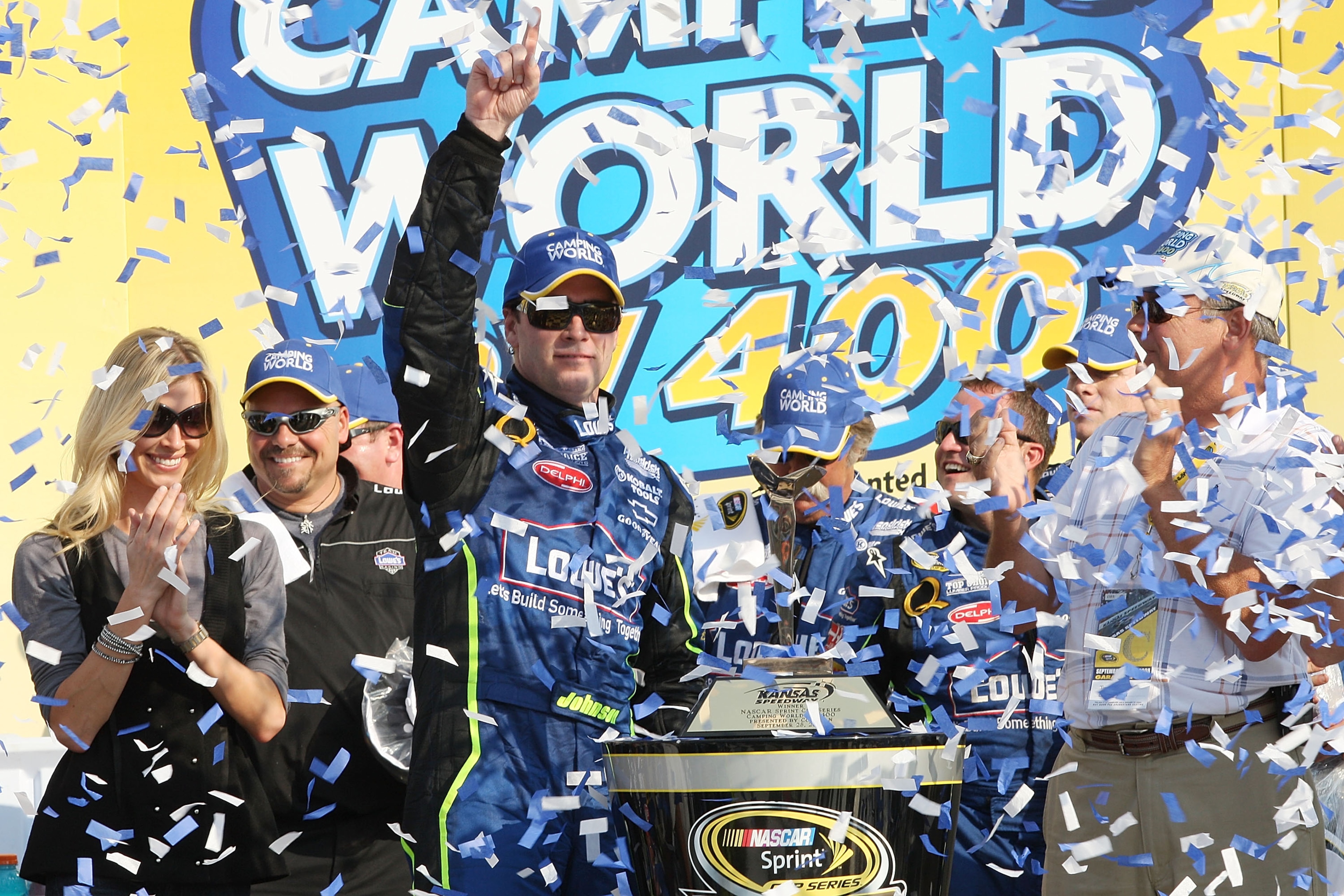 KANSAS CITY, KS - SEPTEMBER 28: Jimmie Johnson driver of the #48 Lowe's Chevrolet celebrates after winning the NASCAR Sprint Cup Series Camping World RV 400 at Kansas Speedway on September 28, 2008 in Kansas City, Kansas. (Photo by John Harrelson/Getty KANSAS CITY, KS - SEPTEMBER 28: Jimmie Johnson driver of the #48 Lowe's Chevrolet celebrates after winning the NASCAR Sprint Cup Series Camping World RV 400 at Kansas Speedway on September 28, 2008 in Kansas City, Kansas. (Photo by John Harrelson/Getty