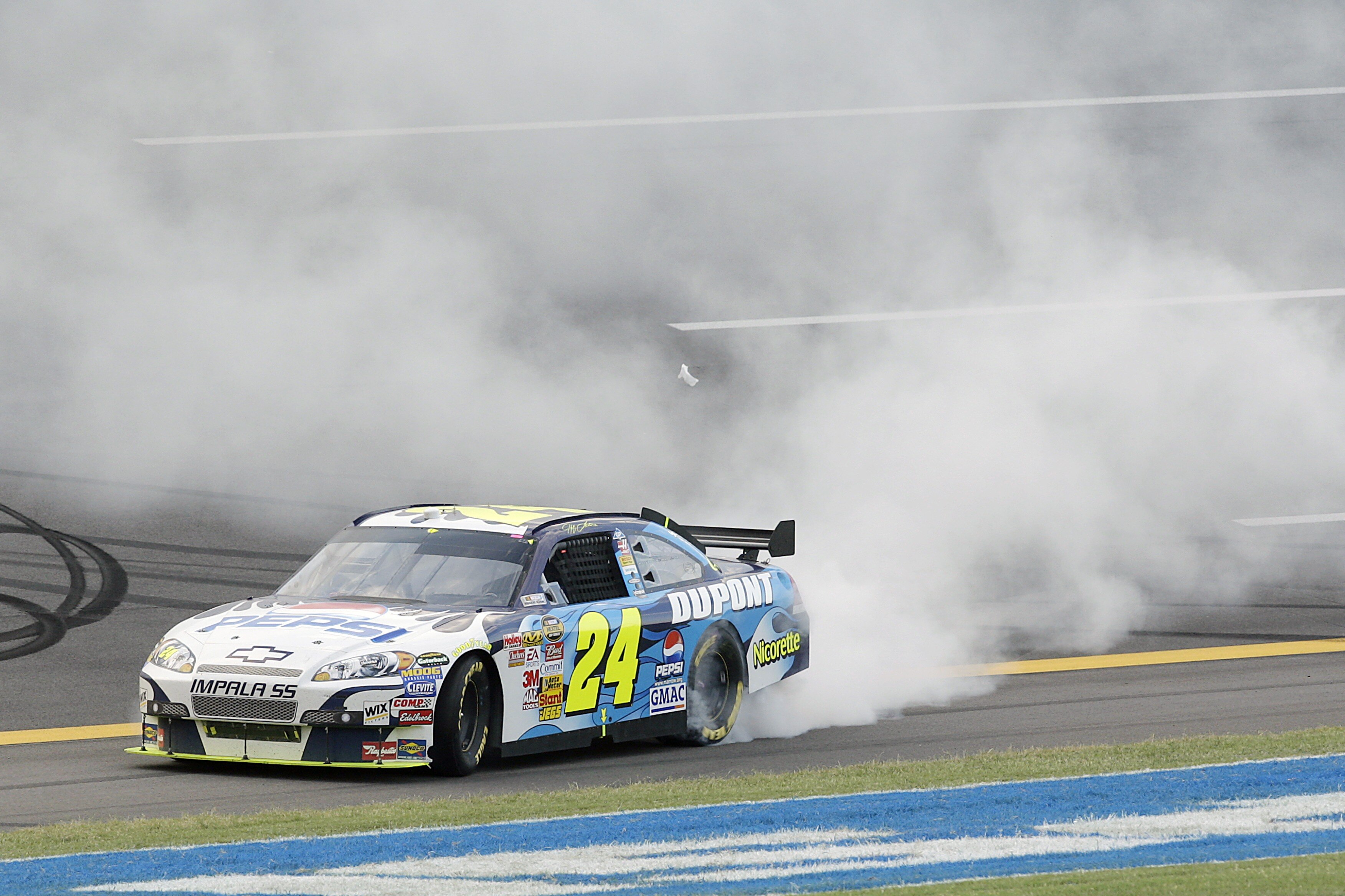 TALLADEGA, AL - OCTOBER 07:  Jeff Gordon, driver of the #24 Dupont/Pepsi Chevrolet, does a burnout after winning the NASCAR Nextel Cup Series UAW-Ford 500 at Talladega Superspeedway on October 7, 2007 in Talladega, Alabama.  (Photo by John Harrelson/Getty