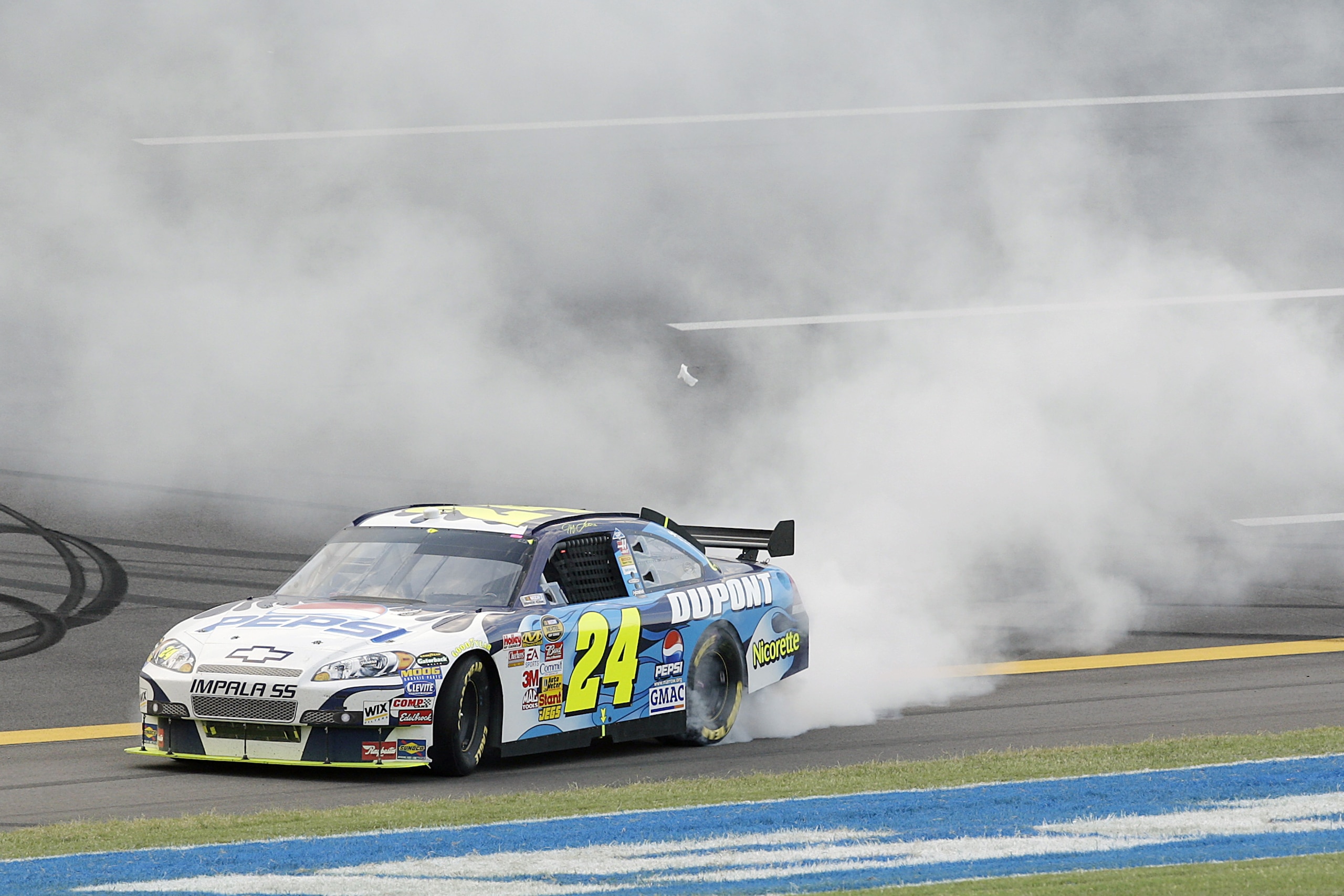TALLADEGA, AL - OCTOBER 07:  Jeff Gordon, driver of the #24 Dupont/Pepsi Chevrolet, does a burnout after winning the NASCAR Nextel Cup Series UAW-Ford 500 at Talladega Superspeedway on October 7, 2007 in Talladega, Alabama.  (Photo by John Harrelson/Getty
