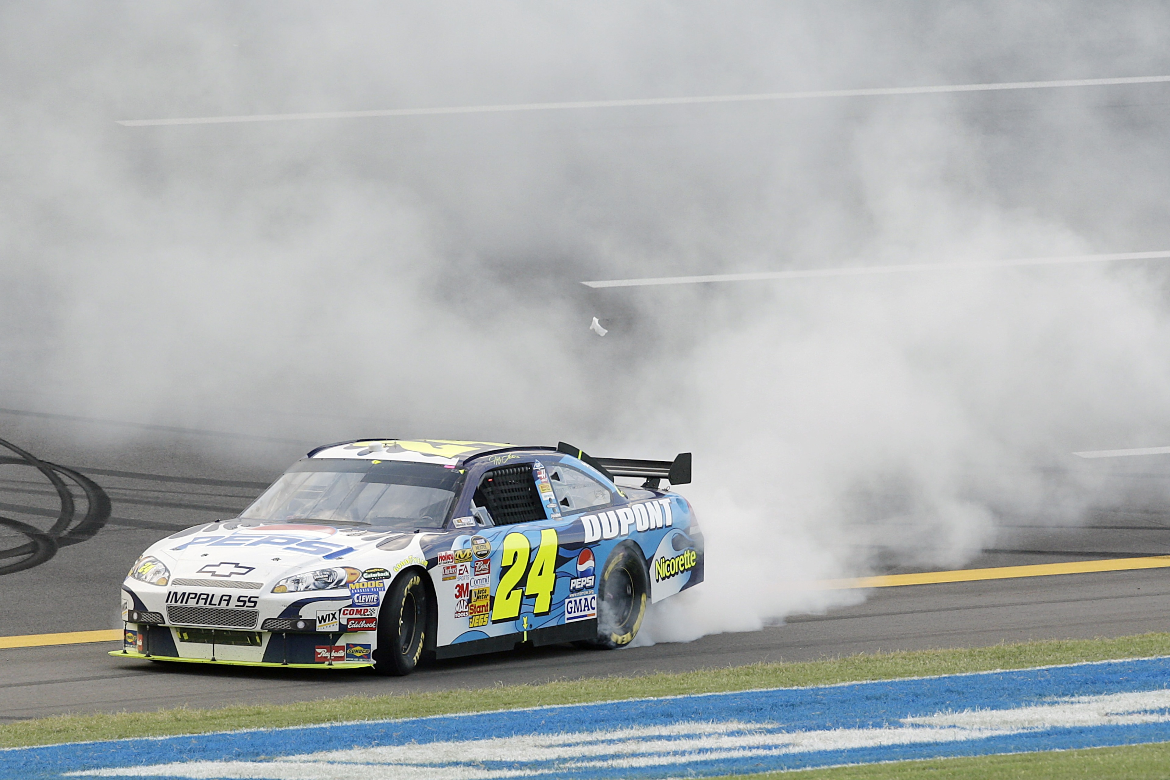 TALLADEGA, AL - OCTOBER 07: Jeff Gordon, driver of the #24 Dupont/Pepsi Chevrolet, does a burnout after winning the NASCAR Nextel Cup Series UAW-Ford 500 at Talladega Superspeedway on October 7, 2007 in Talladega, Alabama. (Photo by John Harrelson/Getty TALLADEGA, AL - OCTOBER 07: Jeff Gordon, driver of the #24 Dupont/Pepsi Chevrolet, does a burnout after winning the NASCAR Nextel Cup Series UAW-Ford 500 at Talladega Superspeedway on October 7, 2007 in Talladega, Alabama. (Photo by John Harrelson/Getty