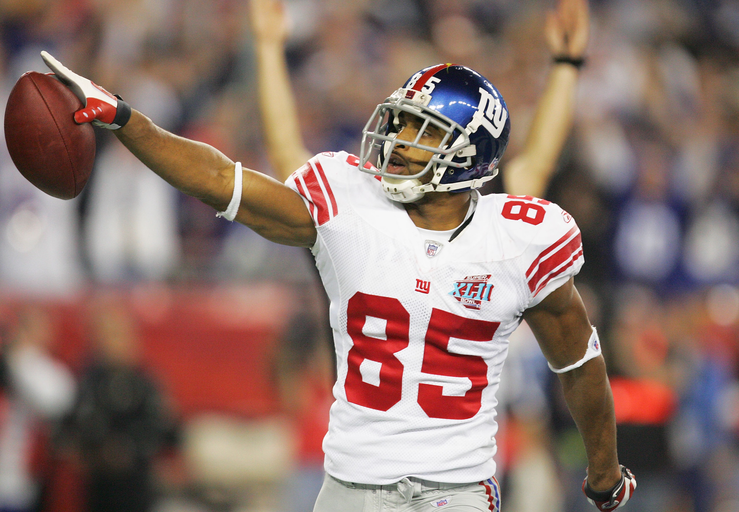 GLENDALE, AZ - FEBRUARY 03:  David Tyree #85 of the New York Giants celebrates his five-yard touchdown reception in the fourth quarter against the New England Patriots during Super Bowl XLII on February 3, 2008 at the University of Phoenix Stadium in Glen