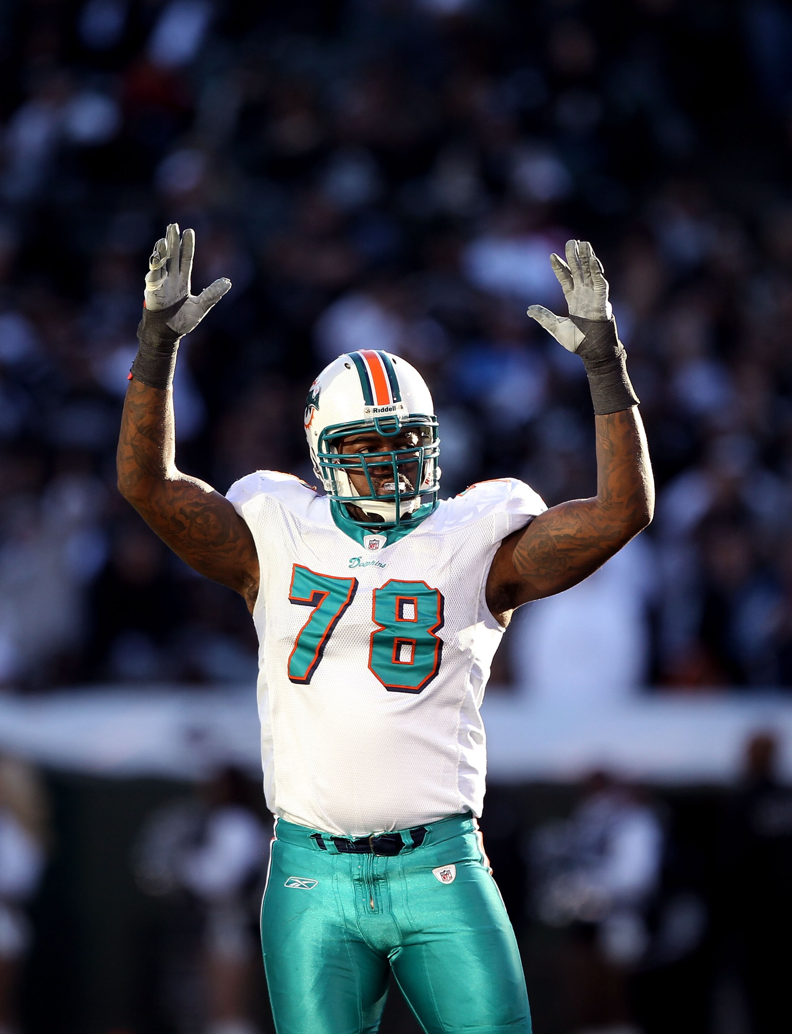 OAKLAND, CA - NOVEMBER 28: Tony McDaniel #78 of the Miami Dolphins celebrates after the Dolphins kicked a field goal against the Oakland Raiders at Oakland-Alameda County Coliseum on November 28, 2010 in Oakland, California. (Photo by Ezra Shaw/Getty Im OAKLAND, CA - NOVEMBER 28: Tony McDaniel #78 of the Miami Dolphins celebrates after the Dolphins kicked a field goal against the Oakland Raiders at Oakland-Alameda County Coliseum on November 28, 2010 in Oakland, California. (Photo by Ezra Shaw/Getty Im