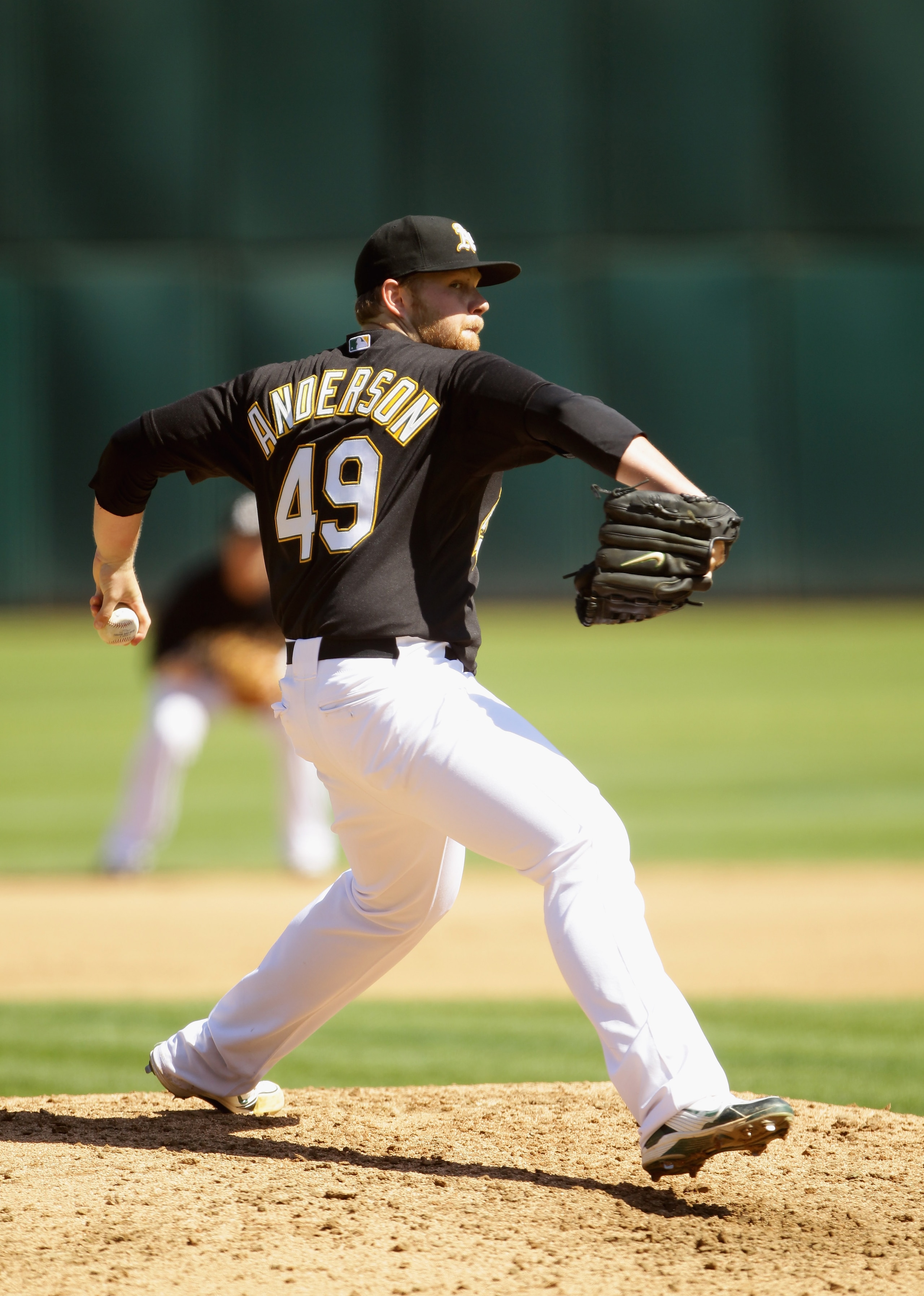 OAKLAND, CA - SEPTEMBER 22: Brett Anderson #49 of the Oakland Athletics pitches against the Chicago White Sox at the Oakland-Alameda County Coliseum on September 22, 2010 in Oakland, California. (Photo by Ezra Shaw/Getty Images) OAKLAND, CA - SEPTEMBER 22: Brett Anderson #49 of the Oakland Athletics pitches against the Chicago White Sox at the Oakland-Alameda County Coliseum on September 22, 2010 in Oakland, California. (Photo by Ezra Shaw/Getty Images)
