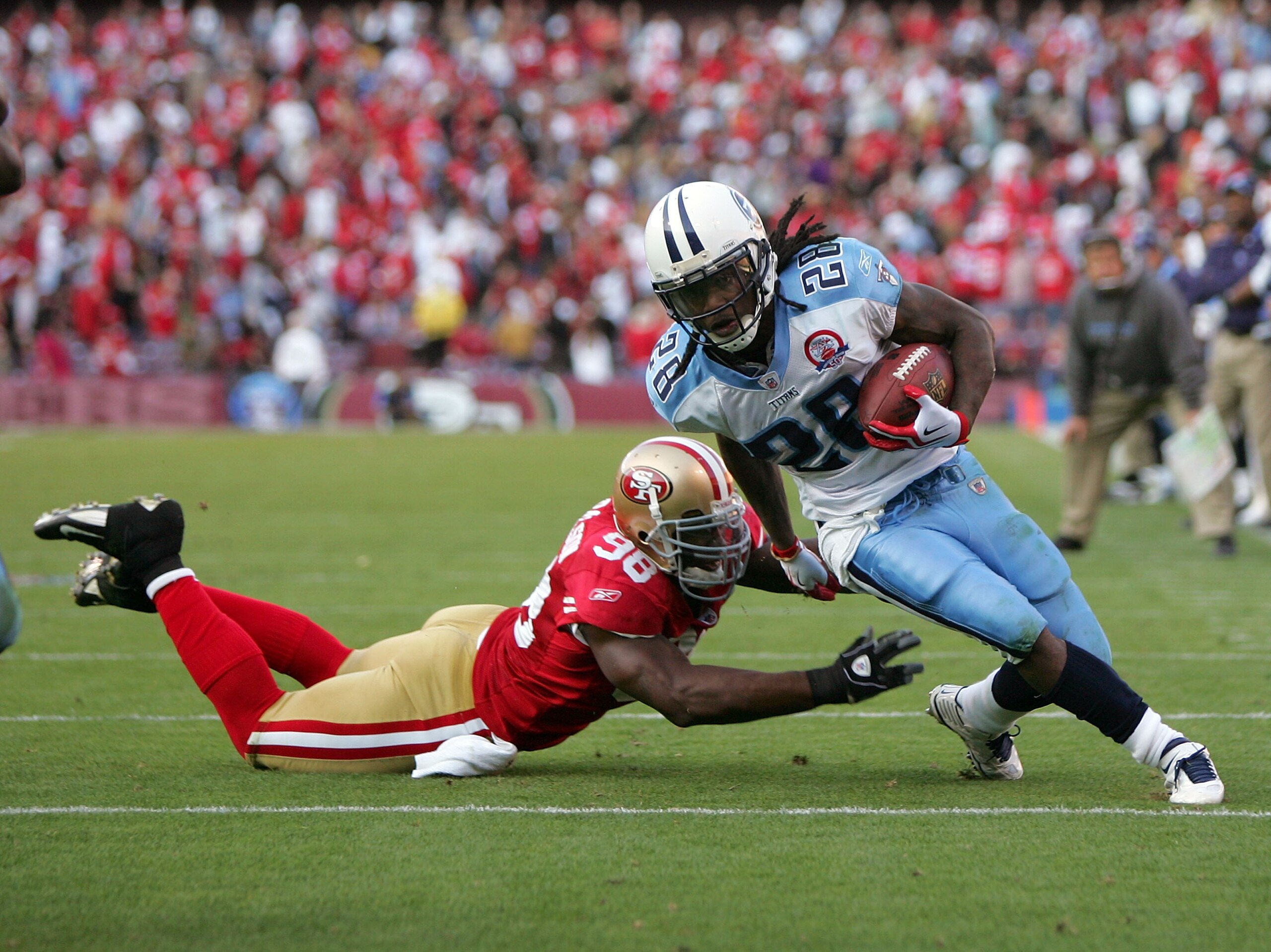 SAN FRANCISCO - NOVEMBER 08: Chris Johnson #28 of the Tennessee Titans gets past Parys Haralson #98 of the San Francisco 49ers on his way in to score a touchdown at Candlestick Park on November 8, 2009 in San Francisco, California. (Photo by Ezra Shaw/G SAN FRANCISCO - NOVEMBER 08: Chris Johnson #28 of the Tennessee Titans gets past Parys Haralson #98 of the San Francisco 49ers on his way in to score a touchdown at Candlestick Park on November 8, 2009 in San Francisco, California. (Photo by Ezra Shaw/G