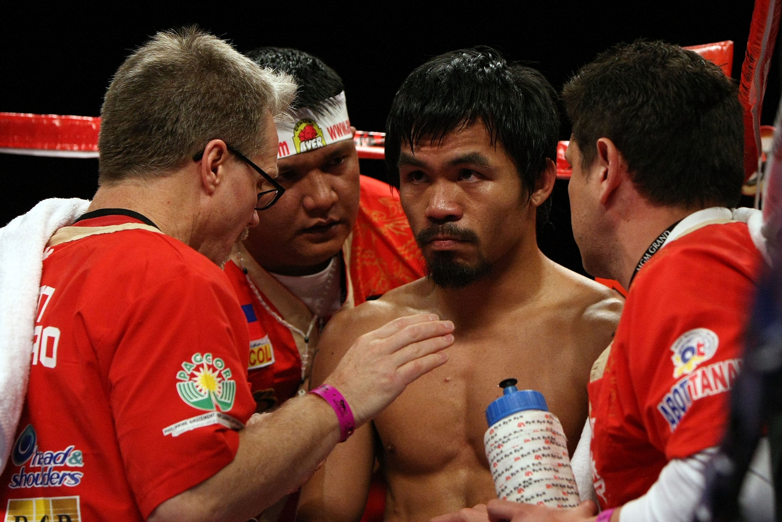 LAS VEGAS - NOVEMBER 14:  Manny Pacquiao sits in his corner between rounds with trainer (L) Freddy Roach during the bout against Miguel Cotto during their WBO welterweight title fight at the MGM Grand Garden Arena on November 14, 2009 in Las Vegas, Nevada