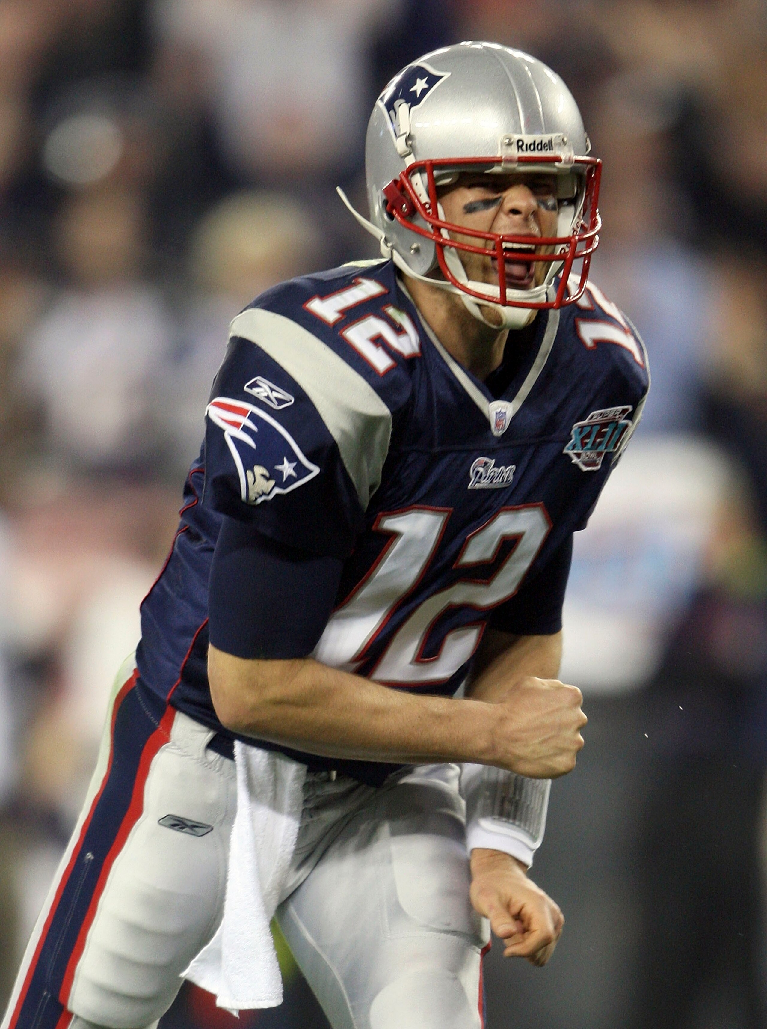GLENDALE, AZ - FEBRUARY 03:  Quarterback Tom Brady #12 of the New England Patriots reacts after Laurence Maroney #39 scored on a 1-yard touchdown run in the second quarter against the New York Giants during Super Bowl XLII on February 3, 2008 at the Unive