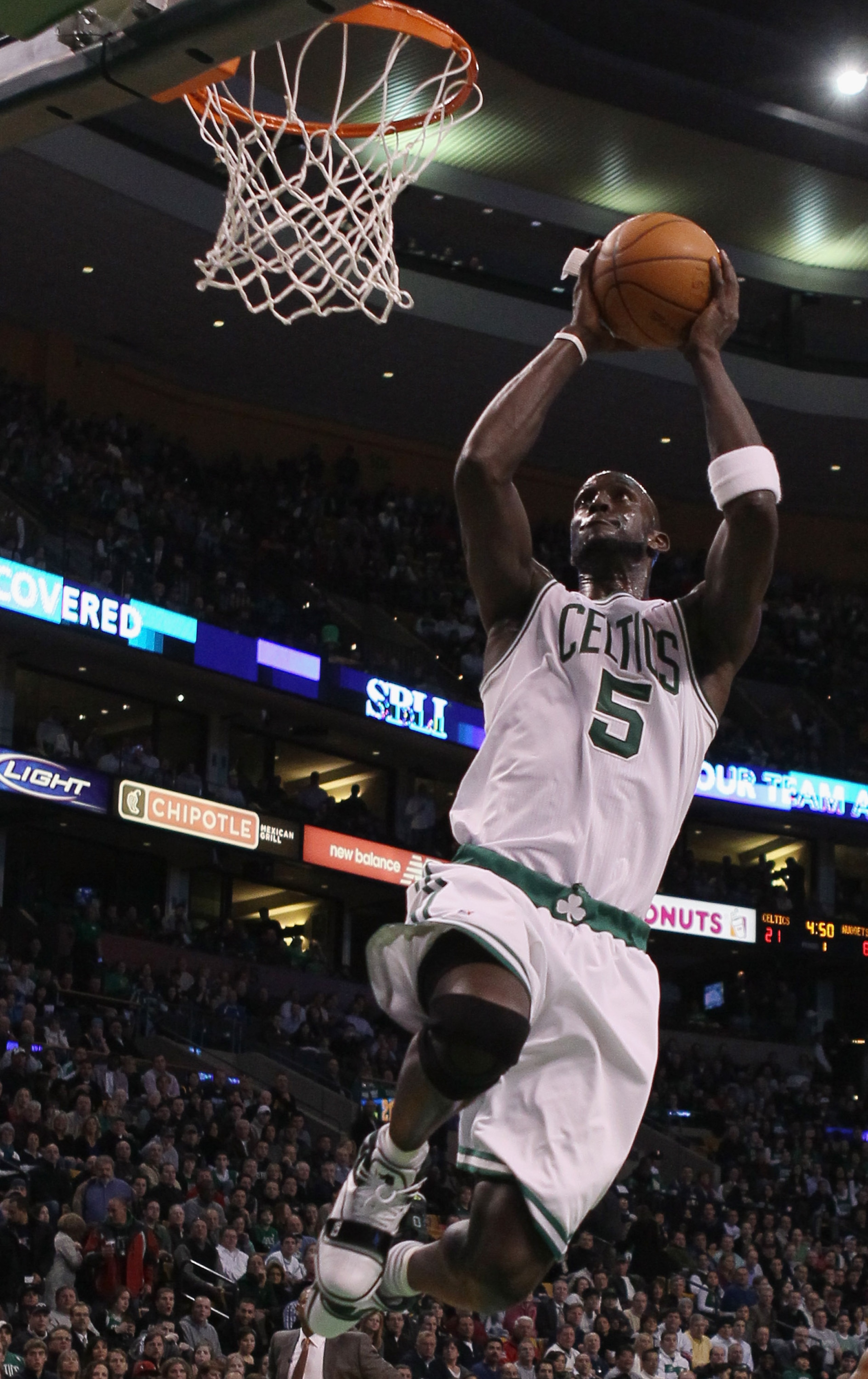 BOSTON, MA - DECEMBER 08:  Kevin Garnett #5 of the Boston Celtics dunks the ball in the first half against the Denver Nuggets on December 8, 2010 at the TD Garden in Boston, Massachusetts. NOTE TO USER: User expressly acknowledges and agrees that, by down