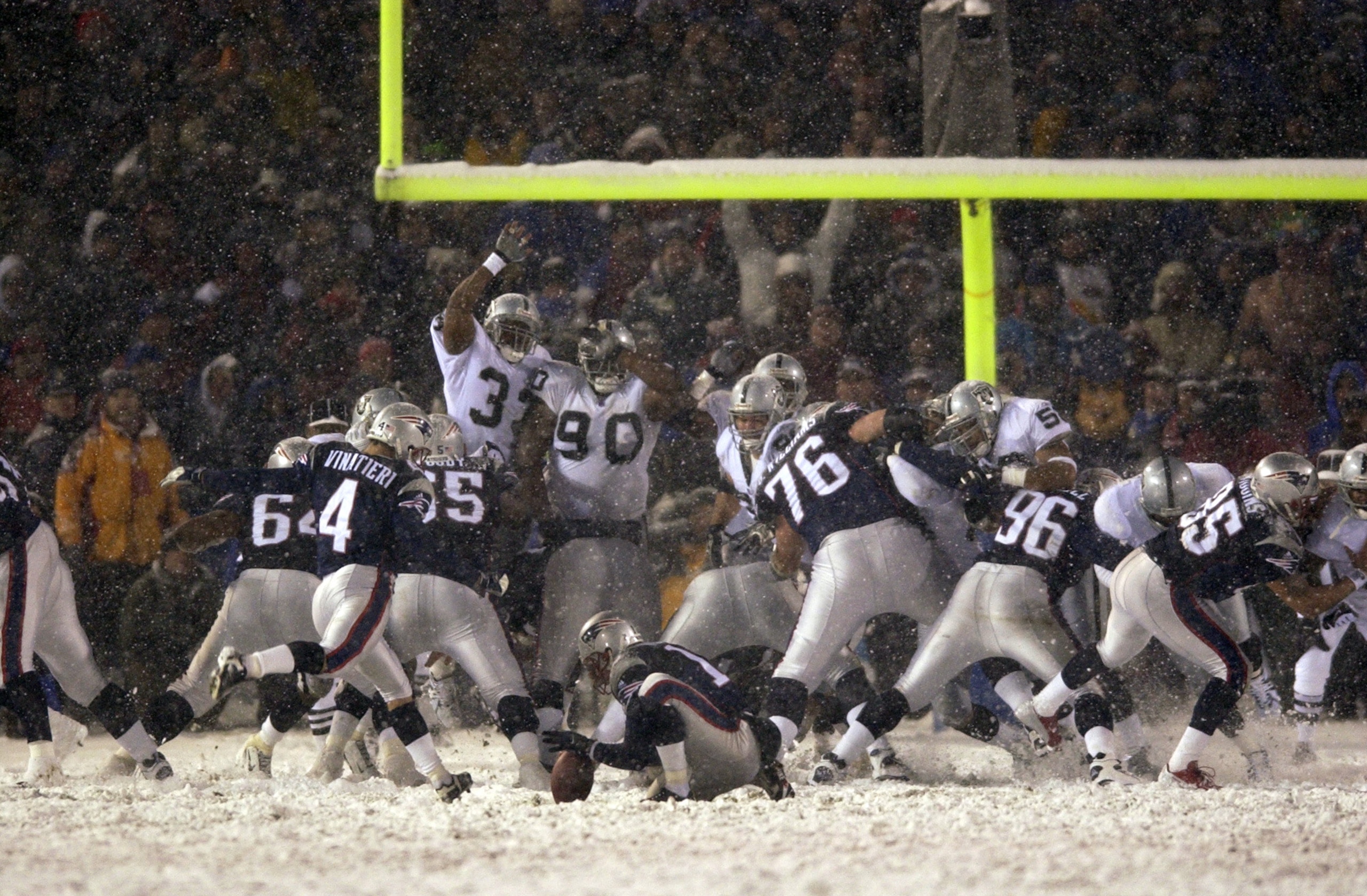 19 Jan 2002:  Adam Vinatieri #4 of the New England Patriots kicks the winning field goal in overtime during the AFC playoff game against the Oakland Raiders at Foxboro Stadium in Foxboro, Massachuesetts. The Patriots came from behind to win 16-13 in overt