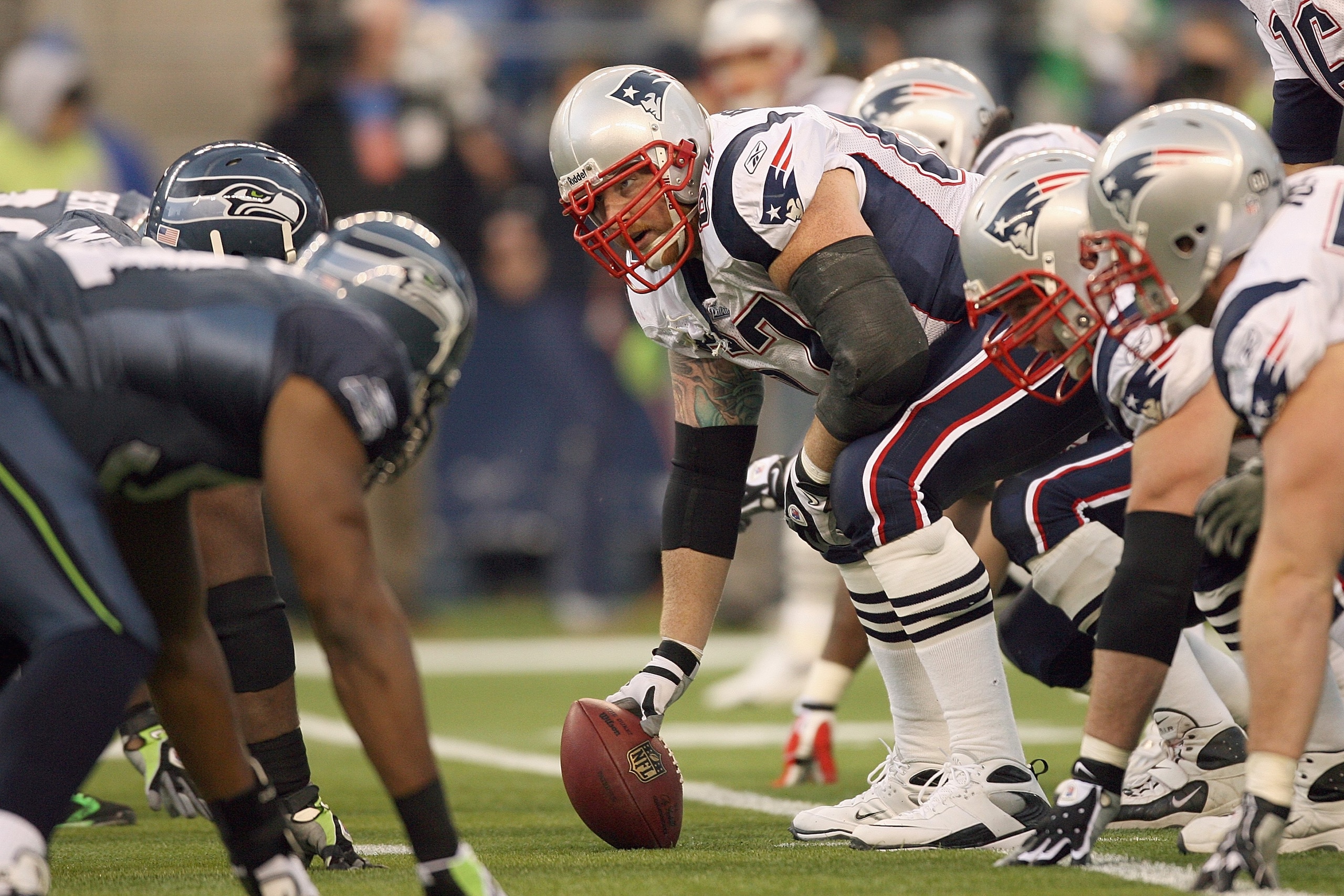 SEATTLE - DECEMBER 07:  Dan Koppen #67 of the New England Patriots gets ready to hike the ball during the game against the Seattle Seahawks on December 7, 2008 at Qwest Field in Seattle, Washington. The Patriots defeated the Seahawks 24-21. (Photo by Otto