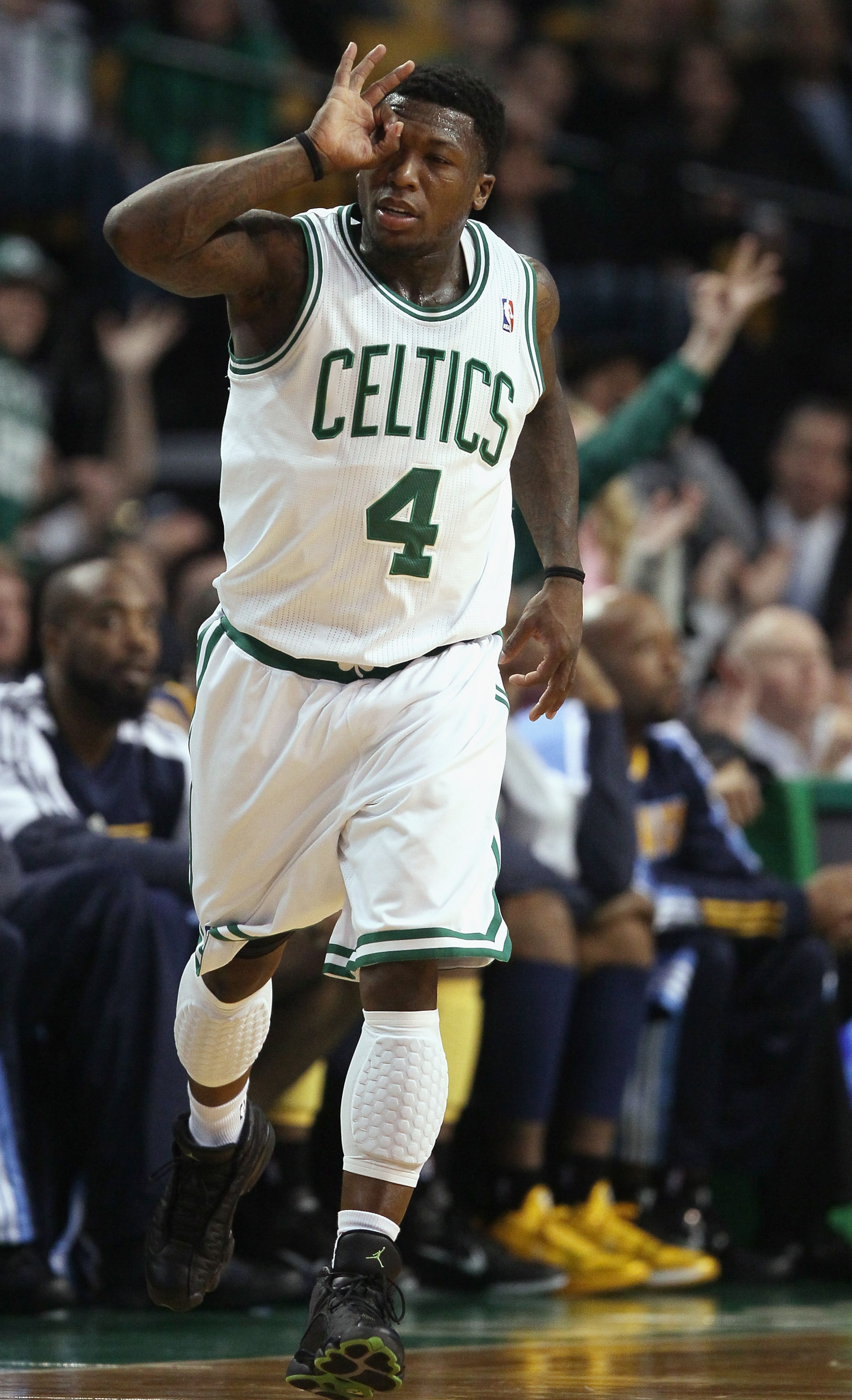 BOSTON, MA - DECEMBER 08:  Nate Robinson #4 of the Boston Celtics celebrates his three point basket in the second half against the Denver Nuggets on December 8, 2010 at the TD Garden in Boston, Massachusetts. The Celtics defeated the Nuggets 105-89. NOTE