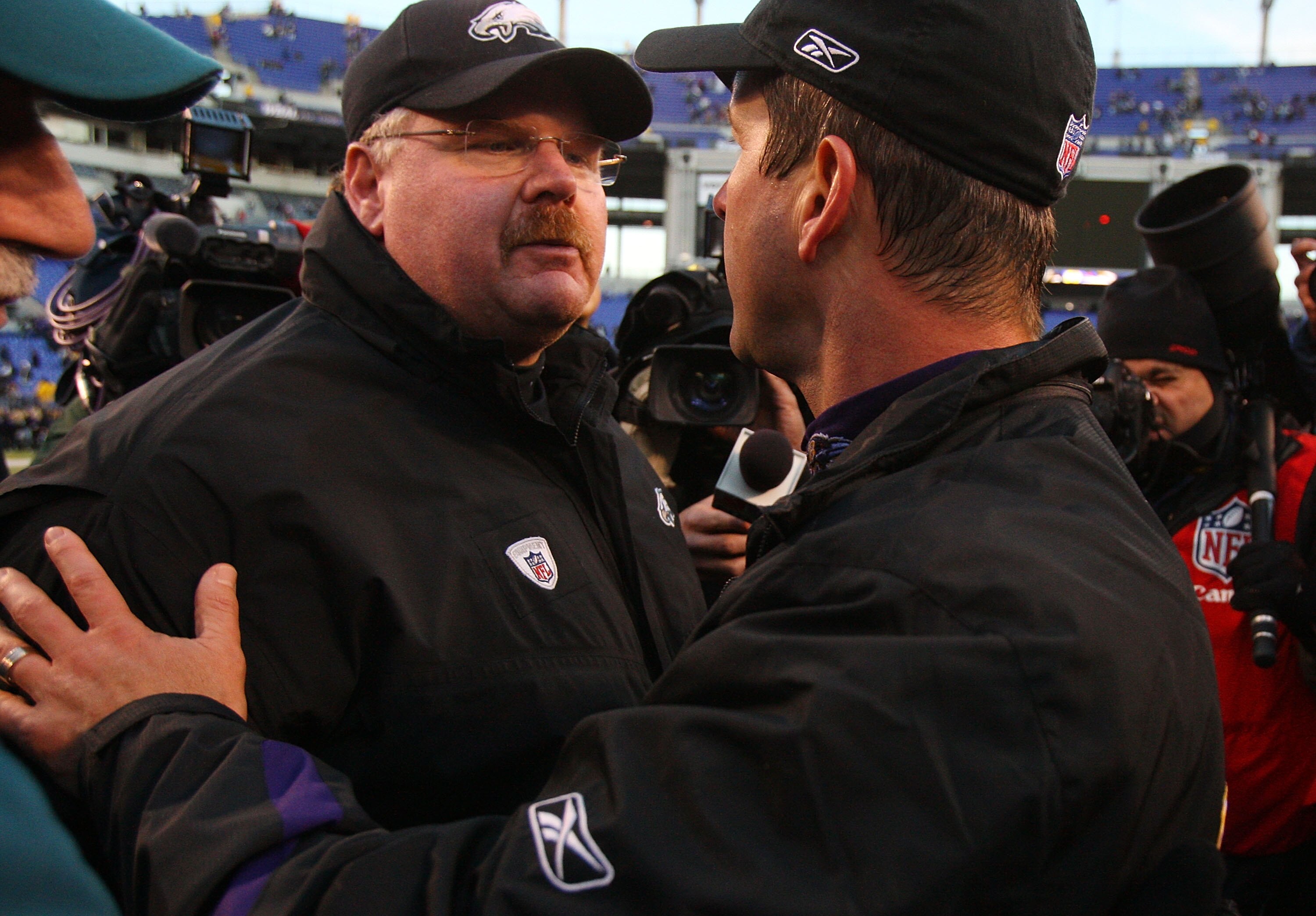 BALTIMORE - NOVEMBER 23: Head coach Andy Reid of the Philadelphia Eagles congratulates head coach John Harbaugh of the Baltimore Ravens after their game on November 23, 2008 at M&T Bank Stadium in Baltimore, Maryland. (Photo by Jim McIsaac/Getty Images)
