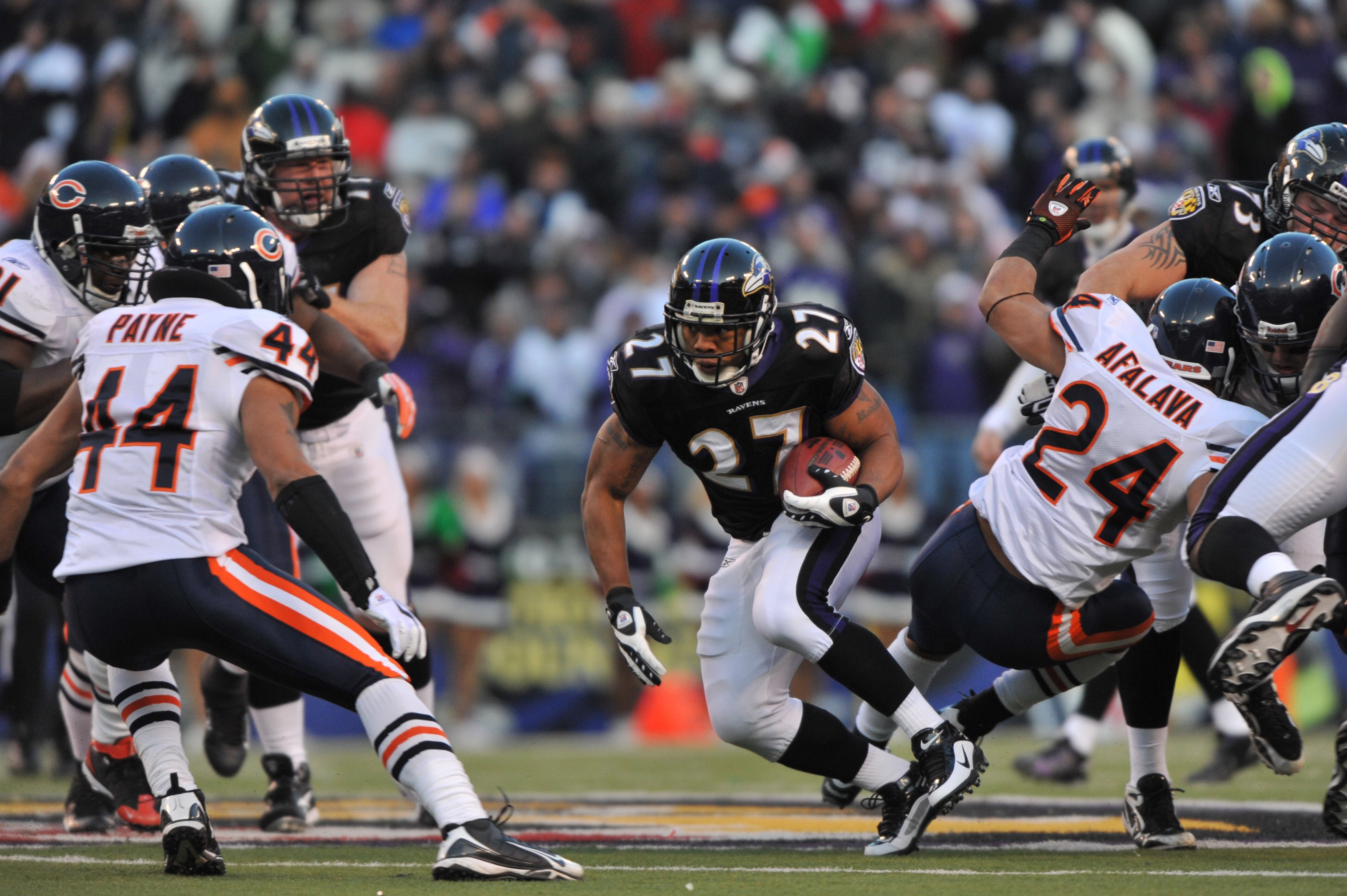 BALTIMORE - DECEMBER 20:  Ray Rice #27 of the Baltimore Ravens runs the ball during the game against the Chicago Bears at M&T Bank Stadium on December 20, 2009 in Baltimore, Maryland. The Ravens defeated the Bears 31-7. (Photo by Larry French/Getty Images