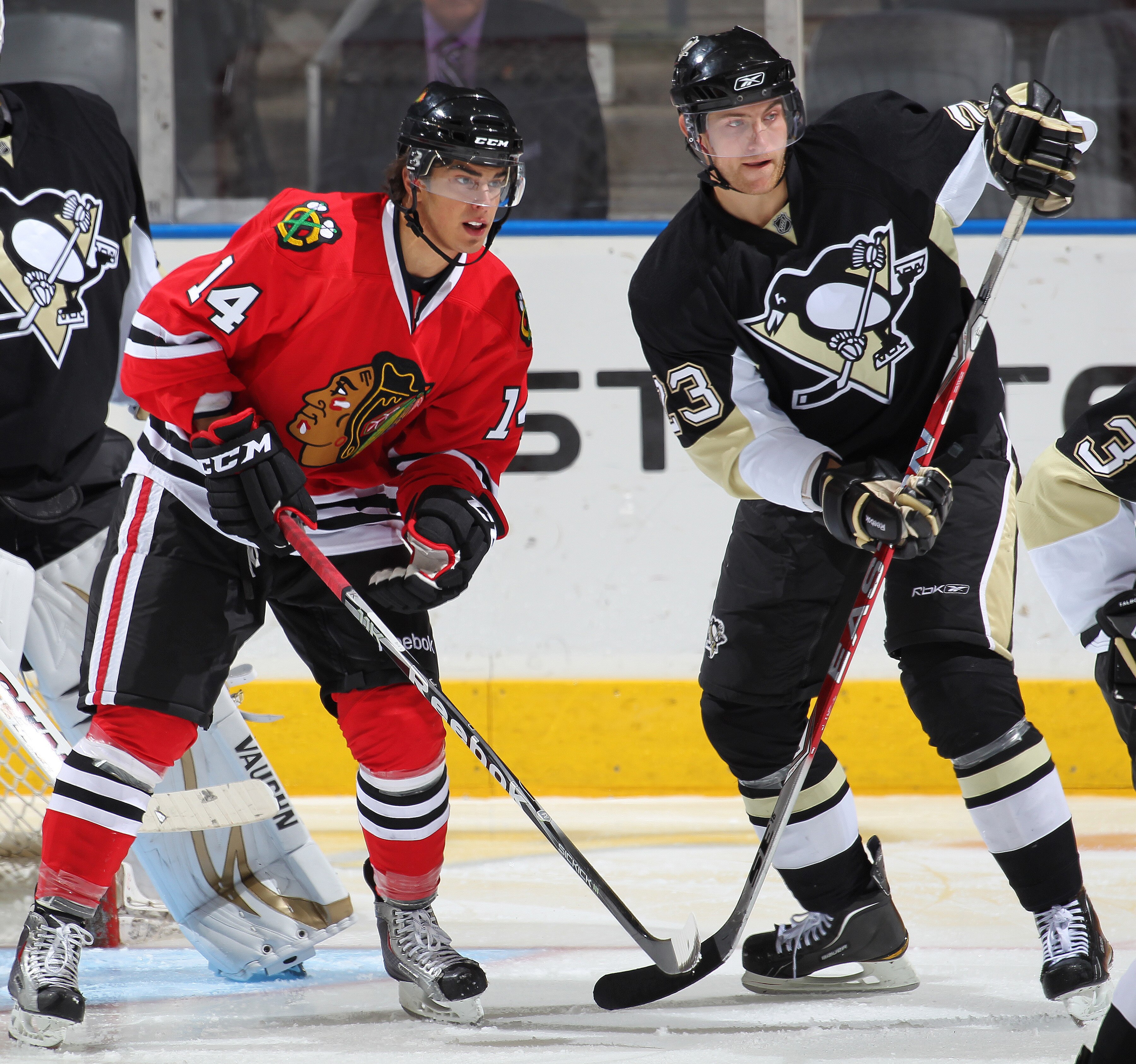 LONDON,ON - SEPTEMBER 14:  Brandon Pirri #14 of the Chicago Black Hawks battles for position with Alex Smigelski #23 of the Pittsburgh Penguins in a game during the NHL Rookie Tournament on September 14,2010 at the John Labatt Centre in London,Ontario. Th