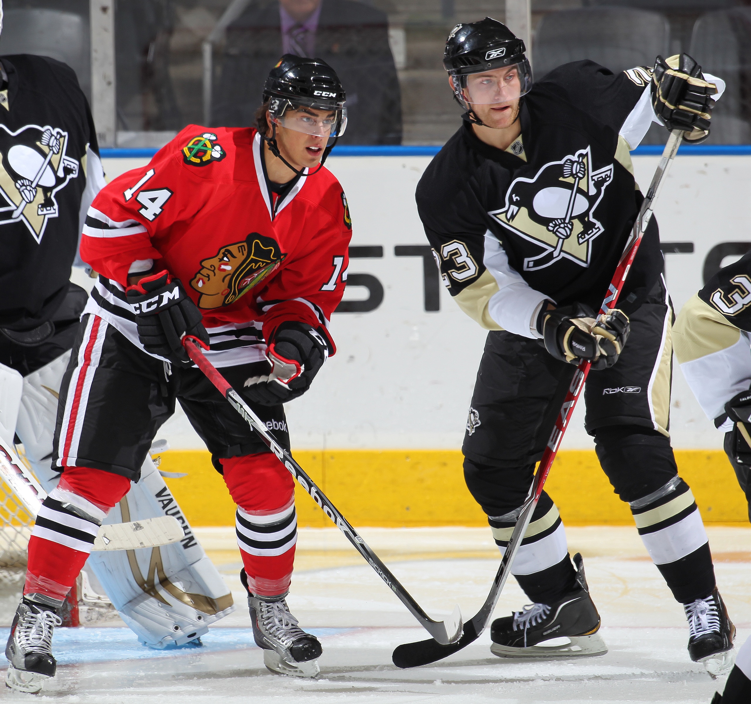 LONDON,ON - SEPTEMBER 14:  Brandon Pirri #14 of the Chicago Black Hawks battles for position with Alex Smigelski #23 of the Pittsburgh Penguins in a game during the NHL Rookie Tournament on September 14,2010 at the John Labatt Centre in London,Ontario. Th