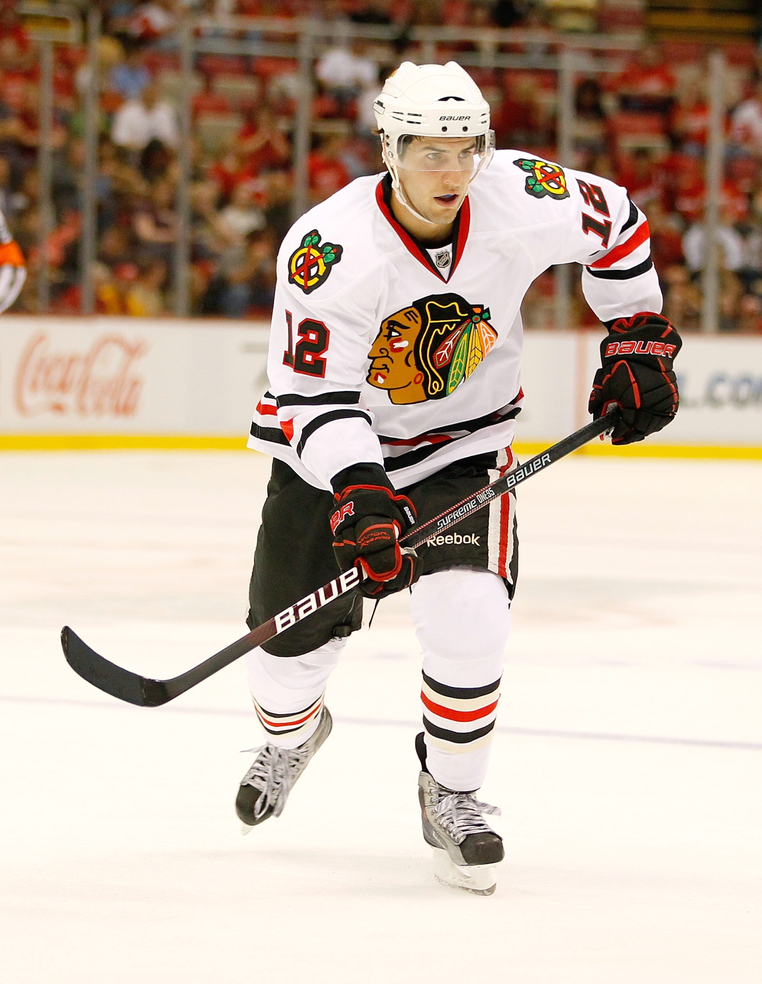 DETROIT - SEPTEMBER 24:  Kyle Beach #12 of the Chicago Blackhawks skates against the Detroit Red Wings during a pre season game on September 24, 2010 at Joe Louis Arena in Detroit, Michigan.  (Photo by Gregory Shamus/Getty Images)