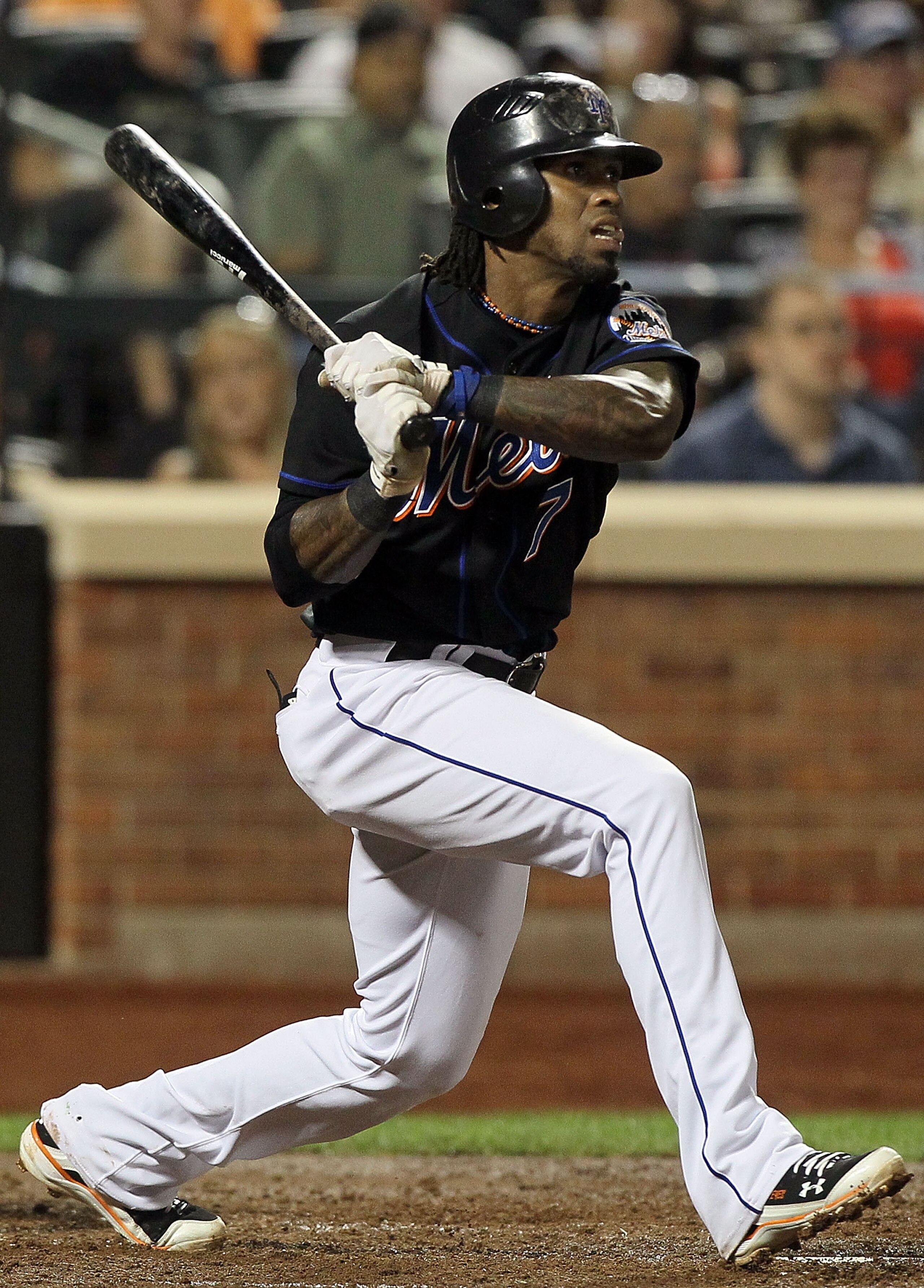 NEW YORK - JULY 31:  Jose Reyes #7 of the New York Mets follows through on a fifth inning RBI single against the Arizona Diamondbacks on July 31, 2010 at Citi Field in the Flushing neighborhood of the Queens borough of New York City.  (Photo by Jim McIsaa