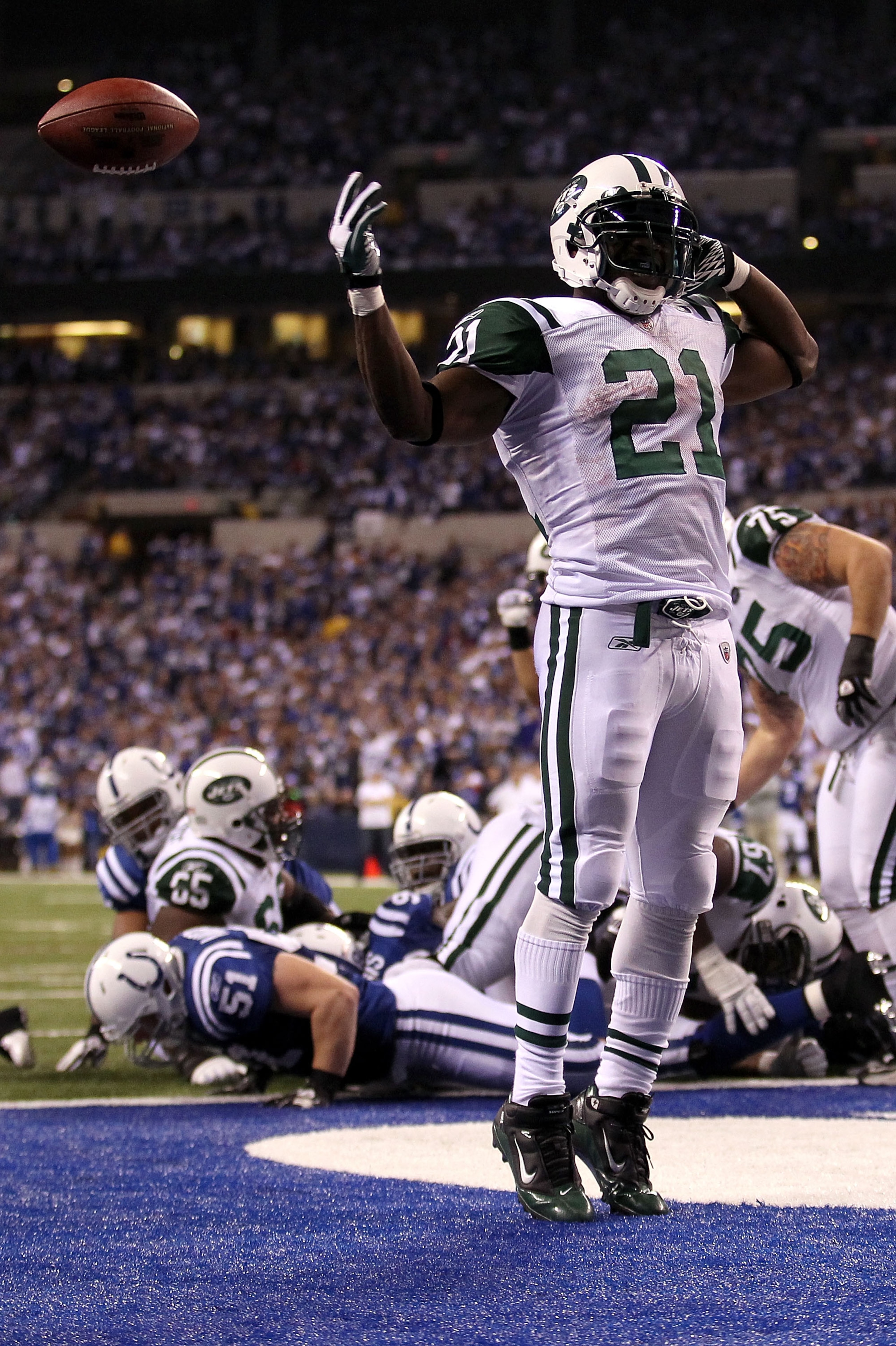 INDIANAPOLIS, IN - JANUARY 08:  LaDainian Tomlinson #21 of the New York Jets celebrates after he scored a 1-yard rushing touchdown in the fourth quarter against the Indianapolis Colts during their 2011 AFC wild card playoff game at Lucas Oil Stadium on Ja