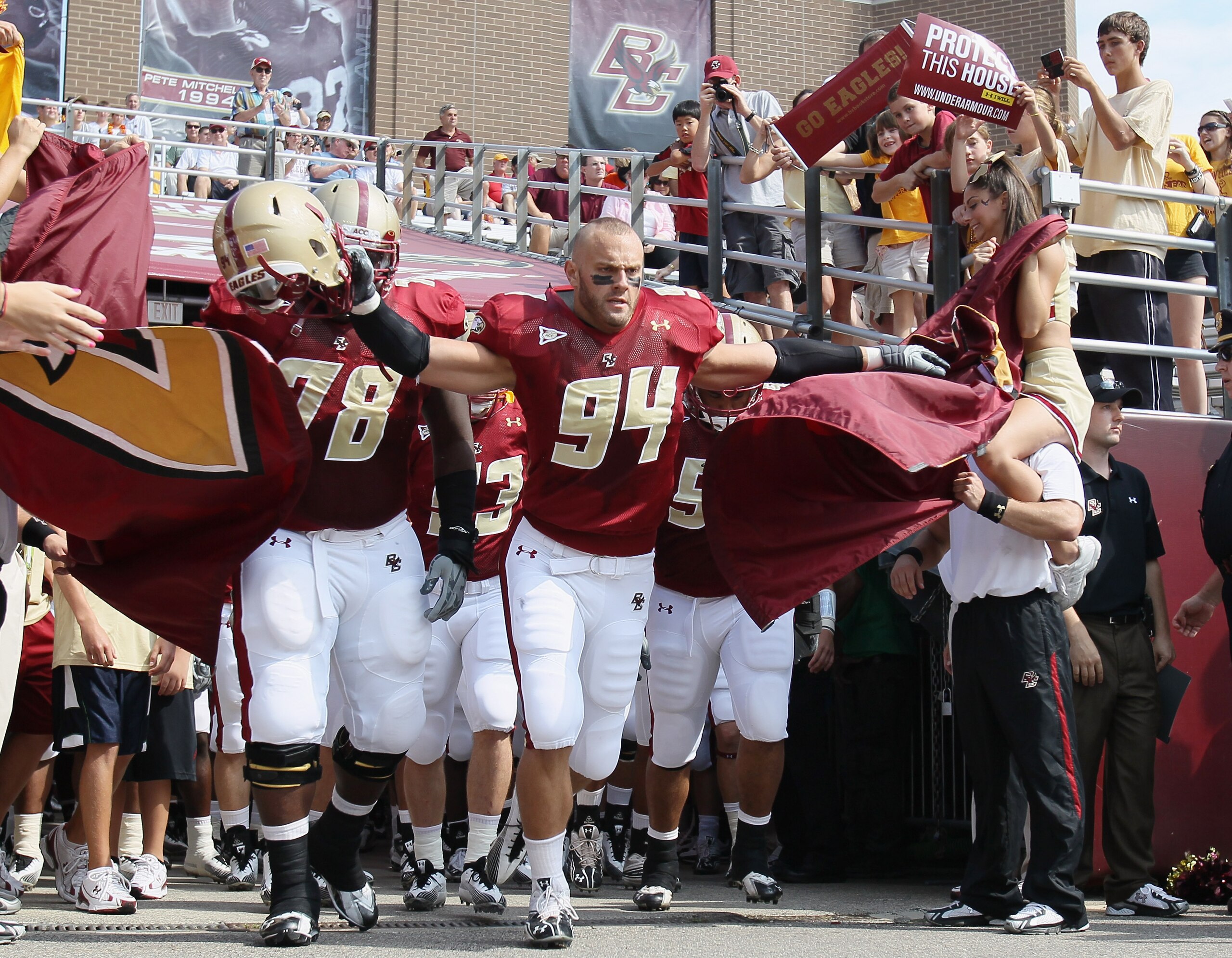 CHESTNUT HILL, MA - SEPTEMBER 25: Mark Herzlich #94 and Thomas Claiborne #78 of the Boston College Eagles lead the team out on the field before the game against the Virginia Tech Hokies on September 25, 2010 at Alumni Stadium in Chestnut Hill, Massachuse CHESTNUT HILL, MA - SEPTEMBER 25: Mark Herzlich #94 and Thomas Claiborne #78 of the Boston College Eagles lead the team out on the field before the game against the Virginia Tech Hokies on September 25, 2010 at Alumni Stadium in Chestnut Hill, Massachuse