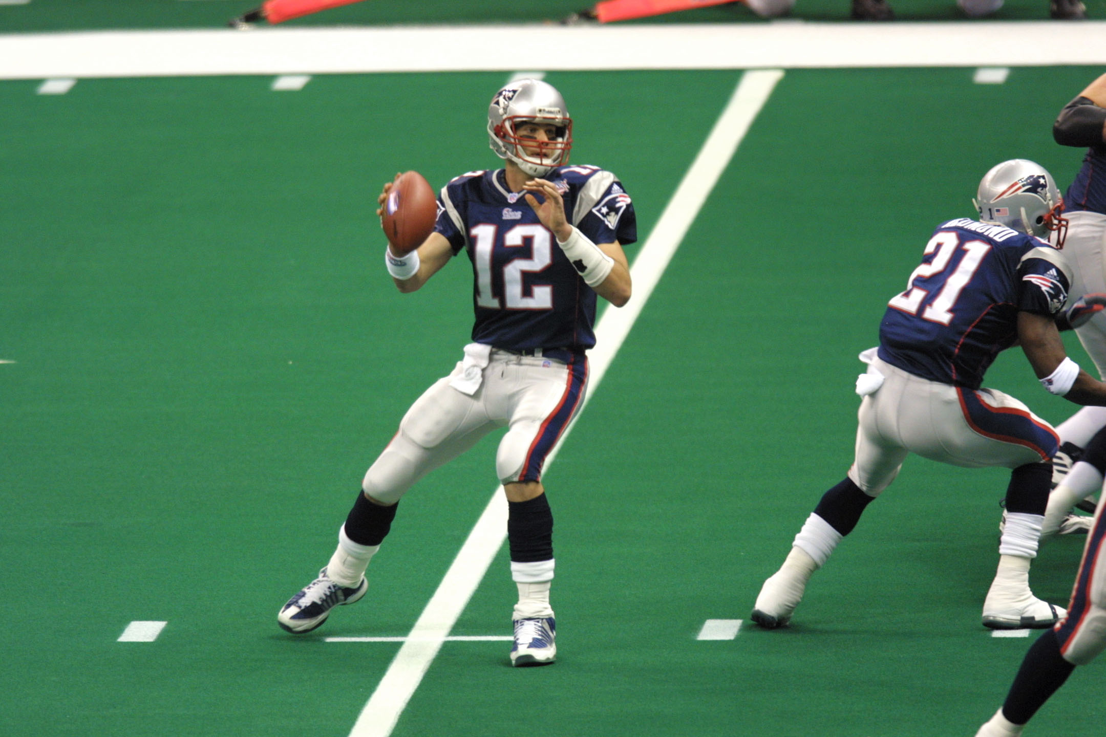 New England Patriots cornerback Otis Smith (45) takes down St. Louis Rams  wide receiver Torry Holt (88) during third-quarter play of Super Bowl XXXVI  at the Louisiana Superdome Sunday, Feb. 3, 2002