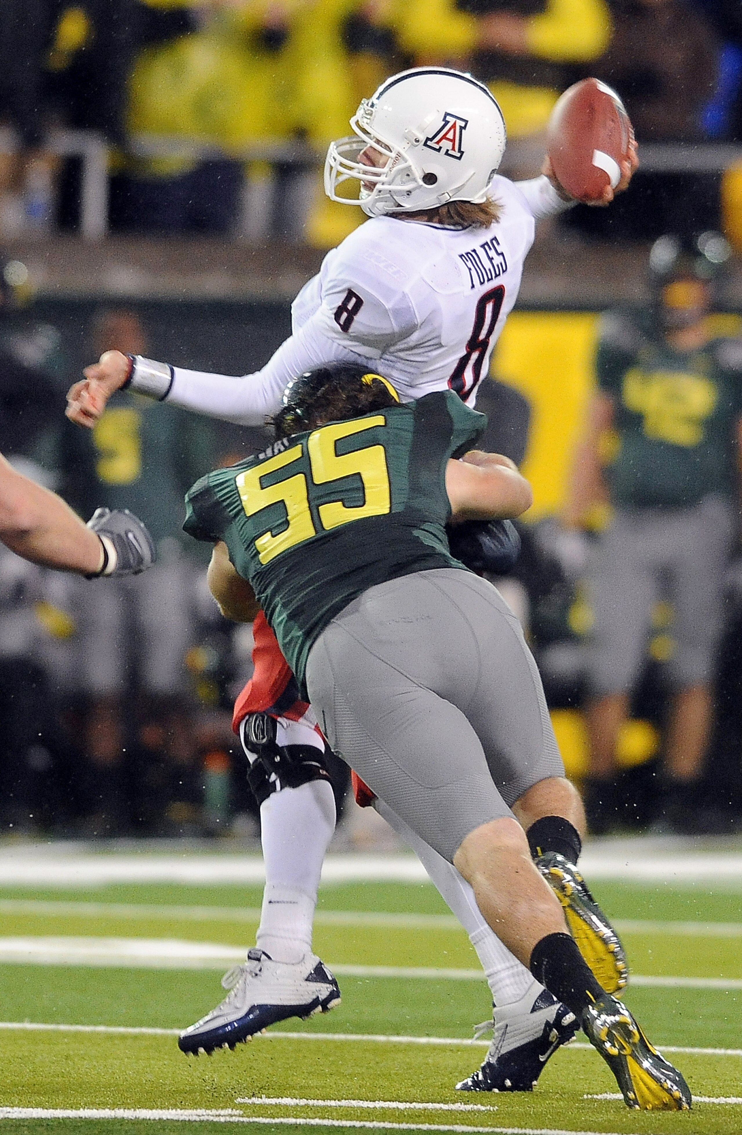 EUGENE, OR - NOVEMBER 26: Quarterback Nick Foles #8 of the Arizona Wildcats is hit by linebacker Casey Matthews #55 of the Oregon Ducks as he throws a pass in the third quarter of the game at Autzen Stadium on November 26, 2010 in Eugene, Oregon.The Ducks EUGENE, OR - NOVEMBER 26: Quarterback Nick Foles #8 of the Arizona Wildcats is hit by linebacker Casey Matthews #55 of the Oregon Ducks as he throws a pass in the third quarter of the game at Autzen Stadium on November 26, 2010 in Eugene, Oregon.The Ducks