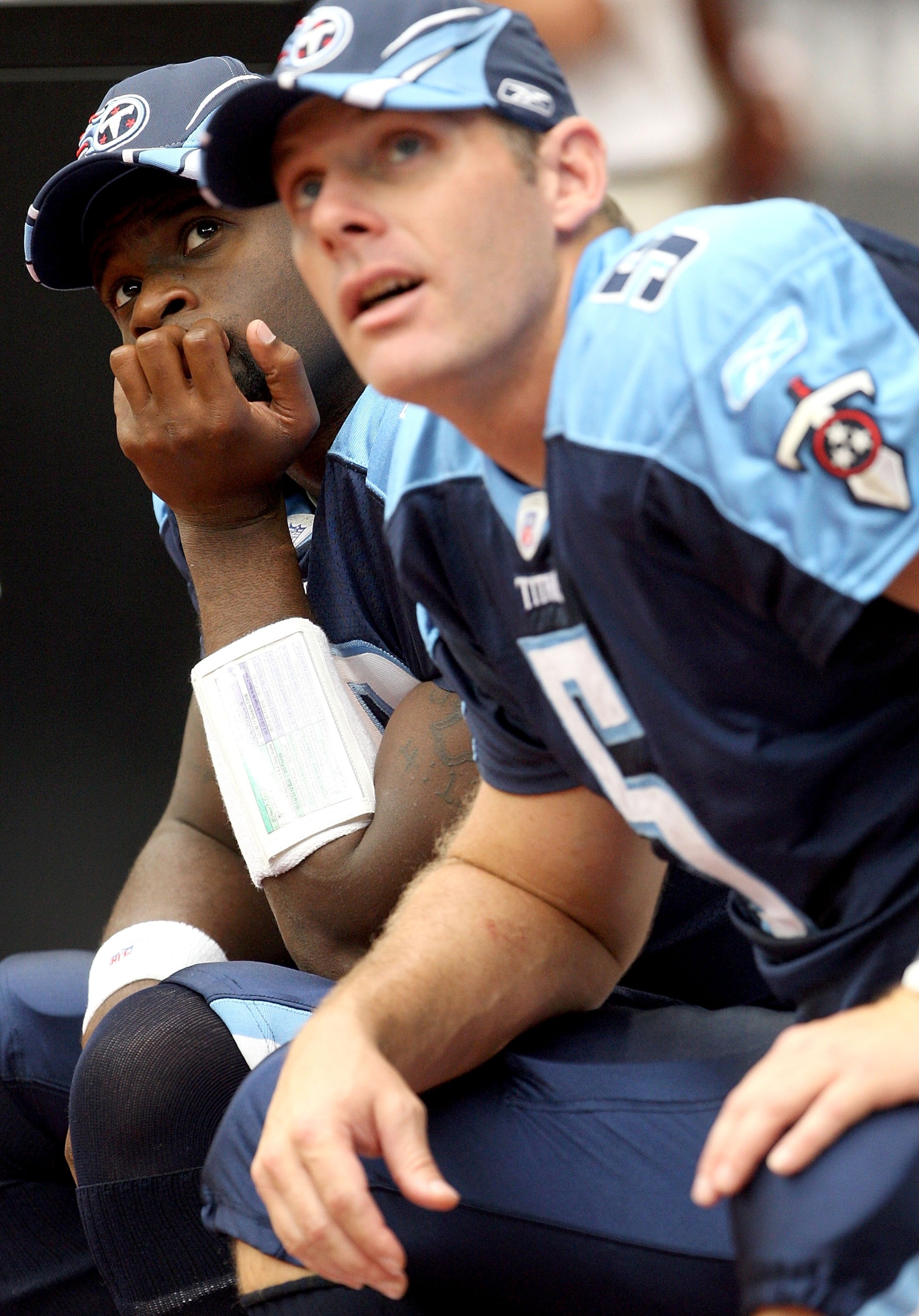 HOUSTON - OCTOBER 21:  Quarterback Vince Young #10 of the Tennessee Titans sits on the bench next to Kerry Collins #5 as they both watch action on the jumbotron during the 1st half of the game against the Houston Texans on October 21, 2007 at Reliant Stad