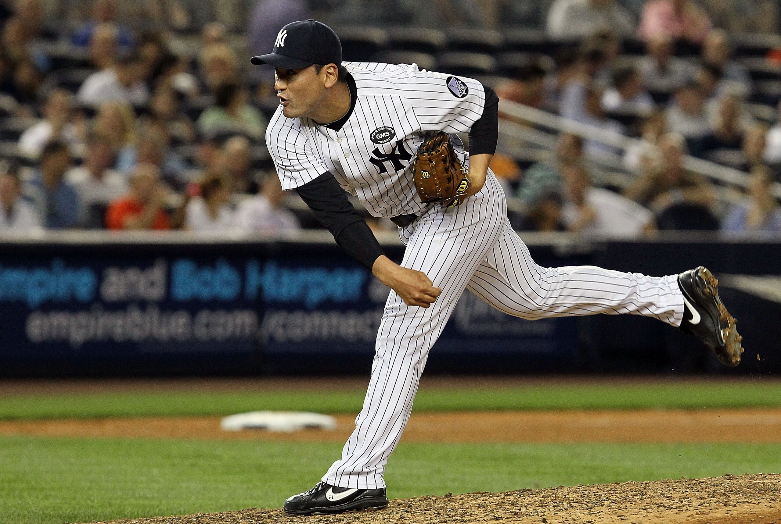 NEW YORK - JULY 20:  Chan Ho-Park #61 of the New York Yankees delivers a pitch against the Los Angeles Angels of Anaheim on July 20, 2010 at Yankee Stadium in the Bronx borough of New York City.  (Photo by Jim McIsaac/Getty Images)