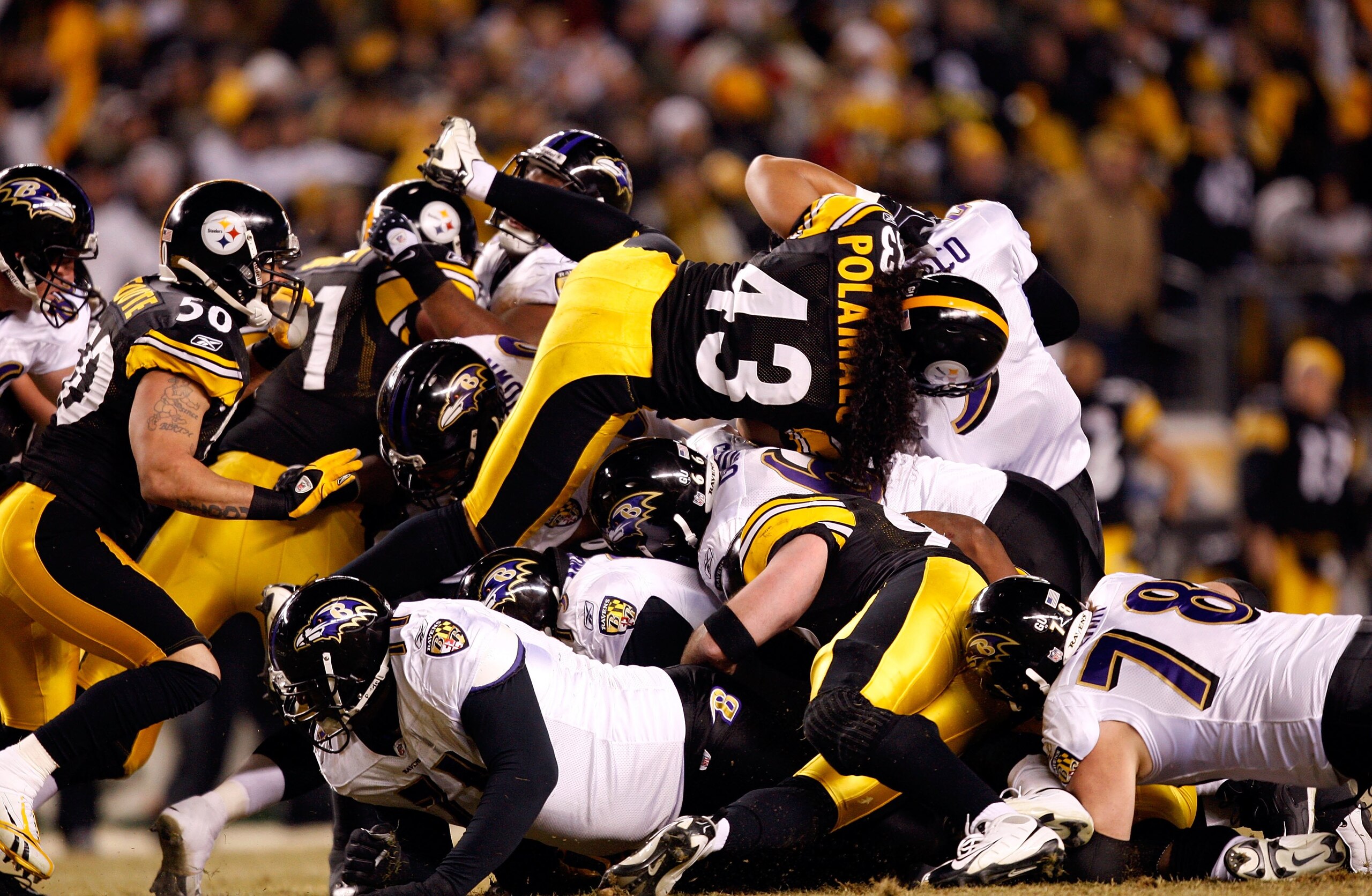 PITTSBURGH - JANUARY 18:  Troy Polamalu #43 of the Pittsburgh Steelers and the Steeler defense stop quarterback Joe Flacco #5 of the Baltimore Ravens on a 4th and 1 play during the AFC Championship game on January 18, 2009 at Heinz Field in Pittsburgh, Pe