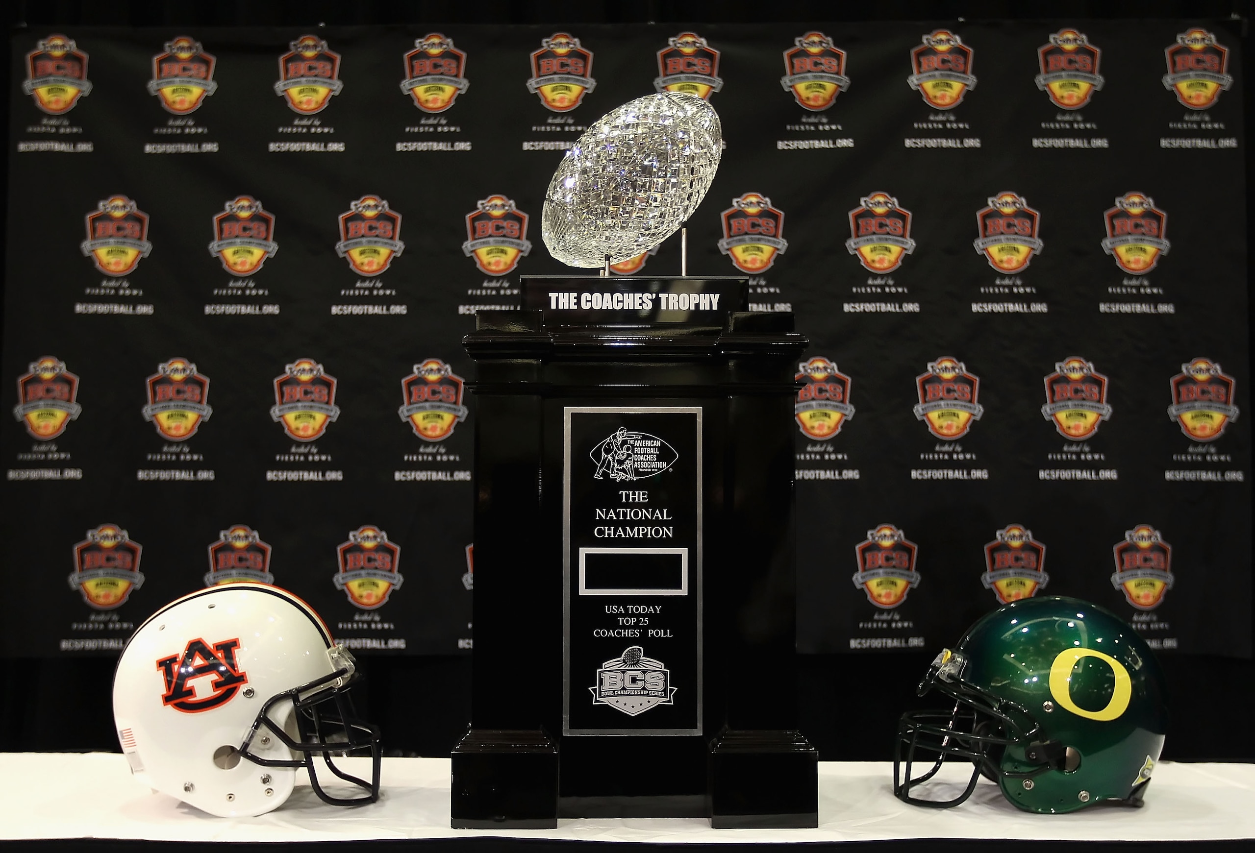 SCOTTSDALE, AZ - JANUARY 07: The coaches trophy is displayed with helmets for the Auburn Tigers and the Oregon Ducks during Media Day for the Tostitos BCS National Championship Game at the JW Marriott Camelback Inn on January 7, 2011 in Scottsdale, Arizo SCOTTSDALE, AZ - JANUARY 07: The coaches trophy is displayed with helmets for the Auburn Tigers and the Oregon Ducks during Media Day for the Tostitos BCS National Championship Game at the JW Marriott Camelback Inn on January 7, 2011 in Scottsdale, Arizo
