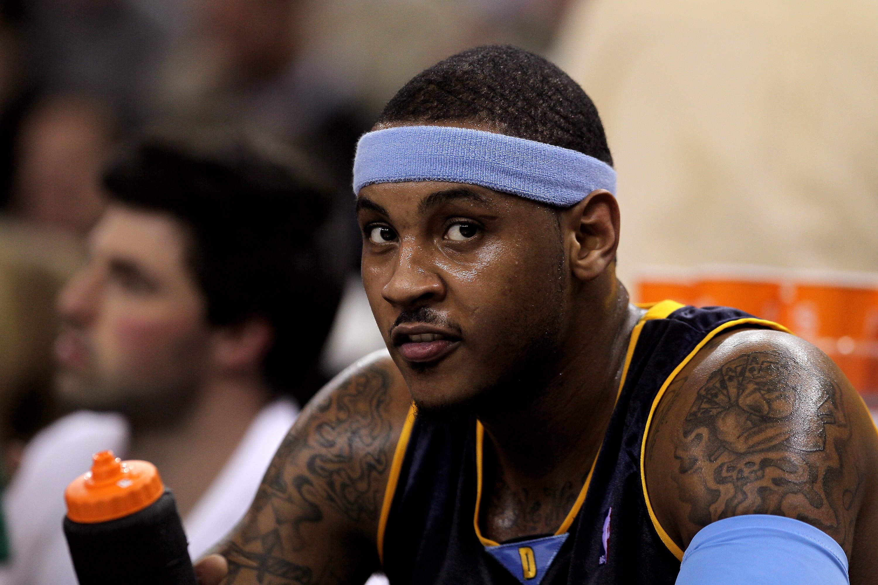 Carmelo Anthony of the Denver Nuggets sits on the bench against