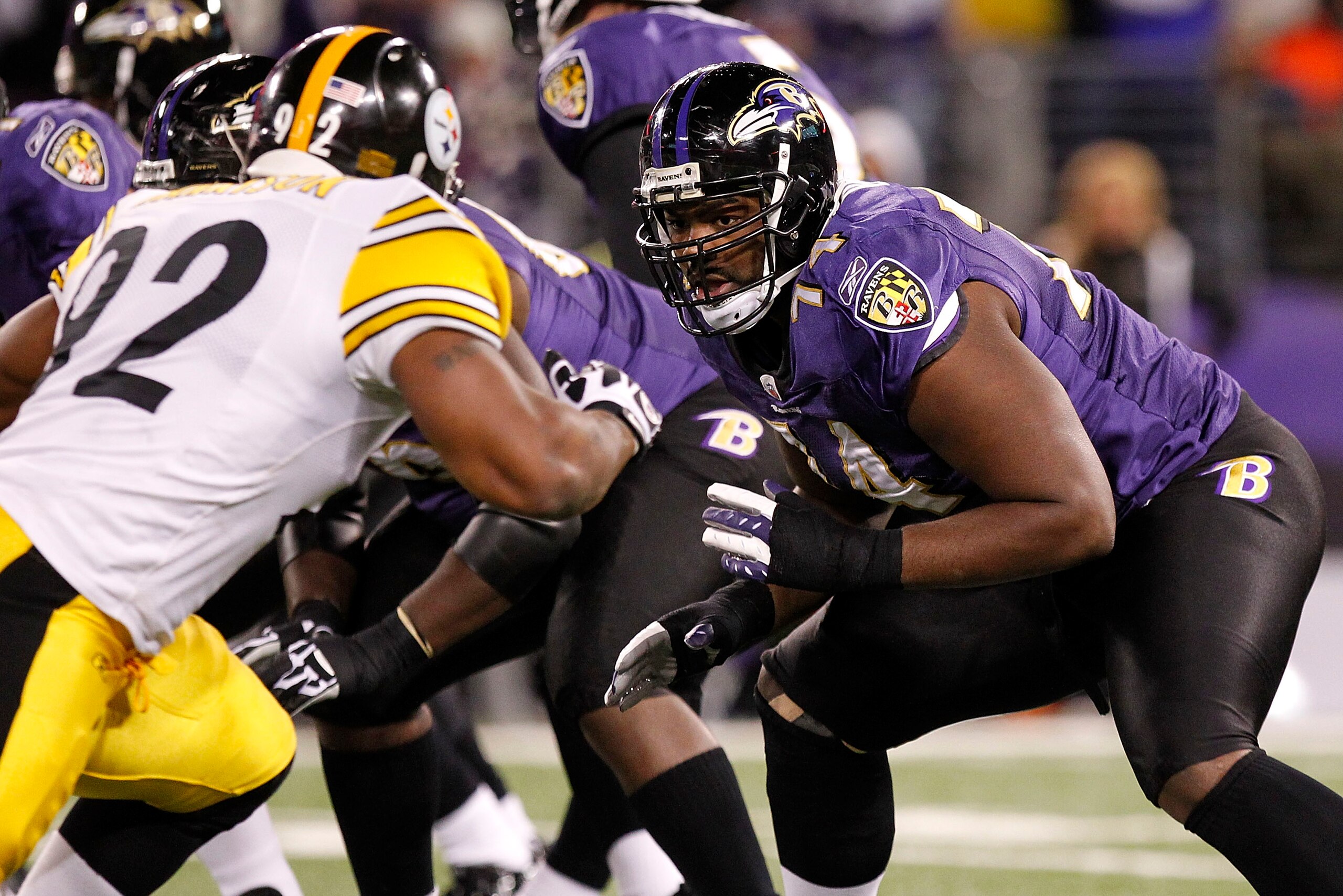BALTIMORE, MD - DECEMBER 05:  Michael Oher #74 of the Baltimore Ravens blocks James Harrison #92 of the Pittsburgh Steelers at M&T Bank Stadium on December 5, 2010 in Baltimore, Maryland.  (Photo by Geoff Burke/Getty Images)