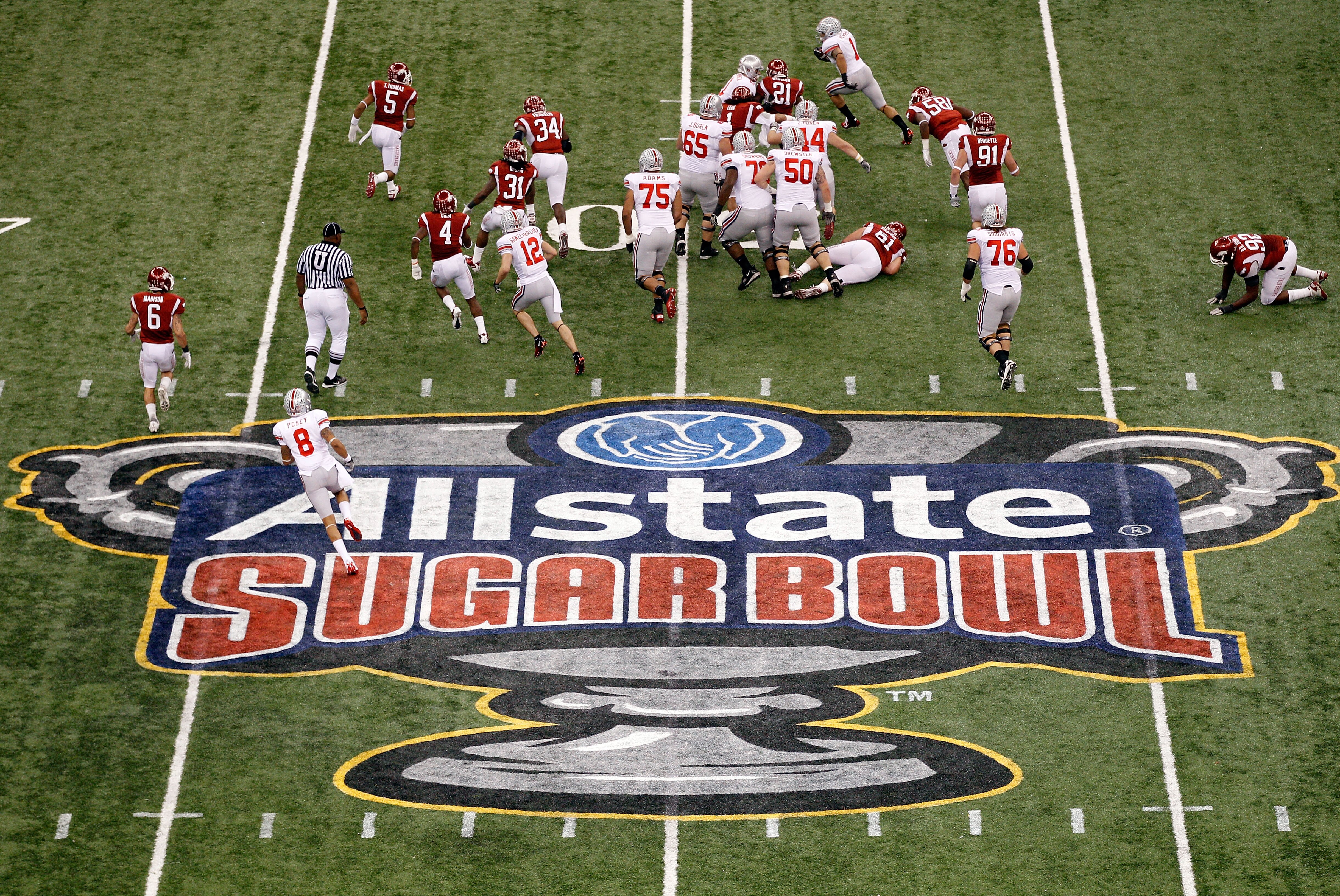 NEW ORLEANS, LA - JANUARY 04:  Dan Herron #1 of the Ohio State Buckeyes runs the ball in the first half against the Arkansas Razorbacks during the Allstate Sugar Bowl at the Louisiana Superdome on January 4, 2011 in New Orleans, Louisiana.  (Photo by Chri