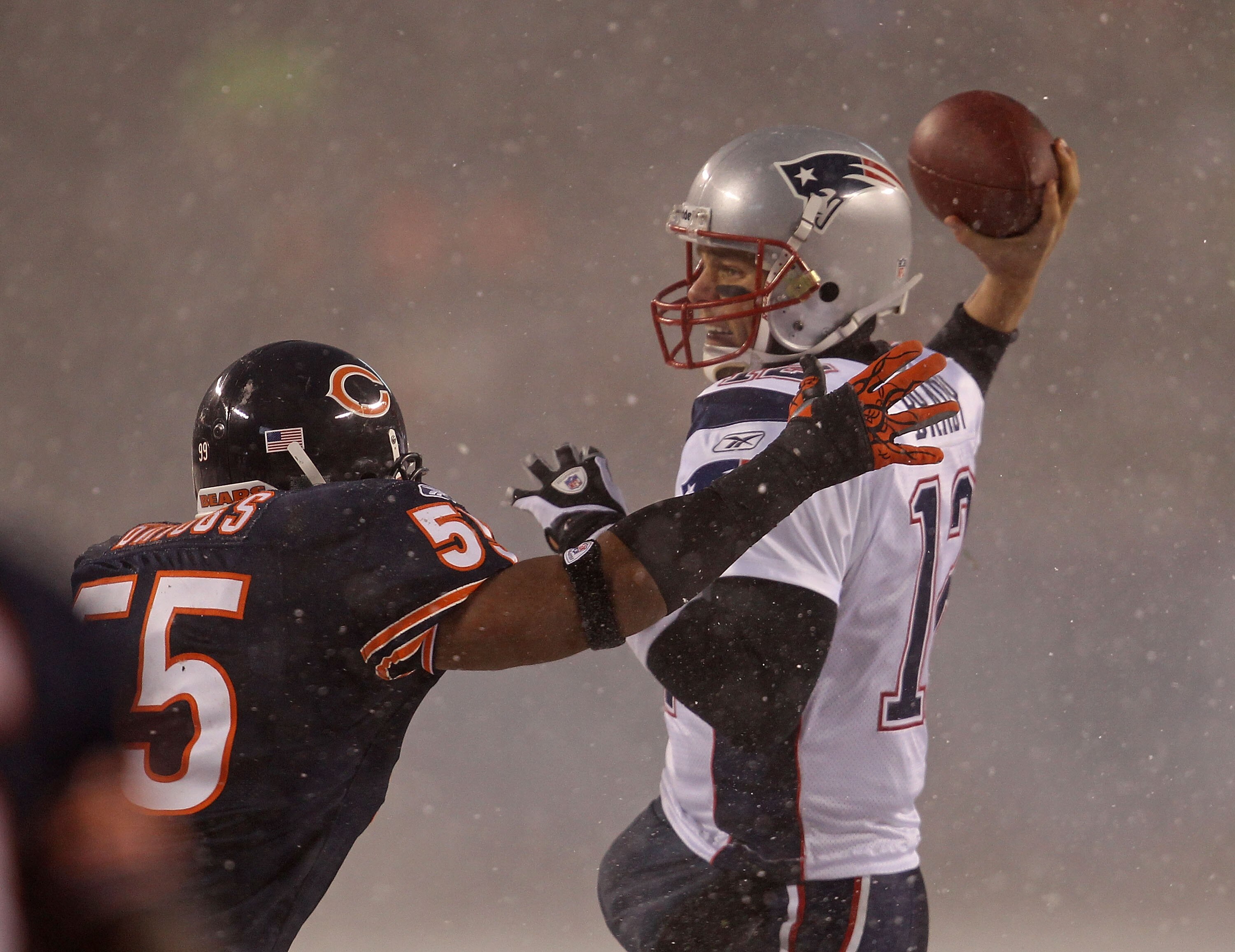 CHICAGO - DECEMBER 12: Tom Brady #12 of the New England Patriots throws a pass under pressure from Lance Briggs #55 of the Chicago Bears at Soldier Field on December 12, 2010 in Chicago, Illinois. (Photo by Jonathan Daniel/Getty Images)
