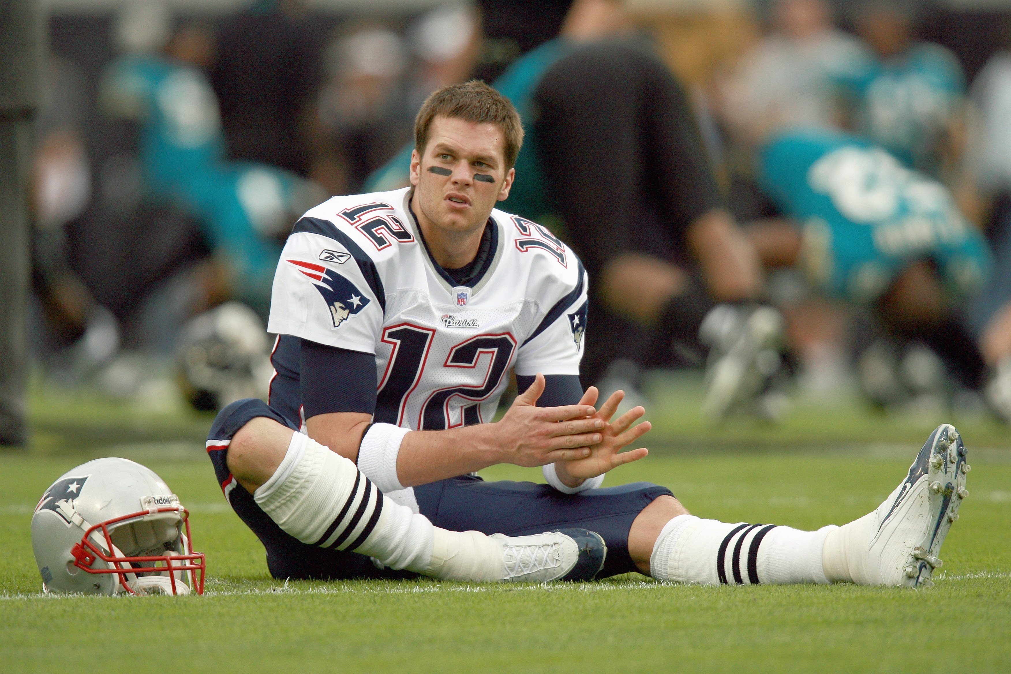 JACKSONVILLE, FL - DECEMBER 24: Tom Brady #12 of the New England Patriots stretches on the field before the game against the Jacksonville Jaguars on December 24, 2006 at Alltel Stadium in Jacksonville, Florida. The Patriots defeated the Jaguars 24-21. (Ph