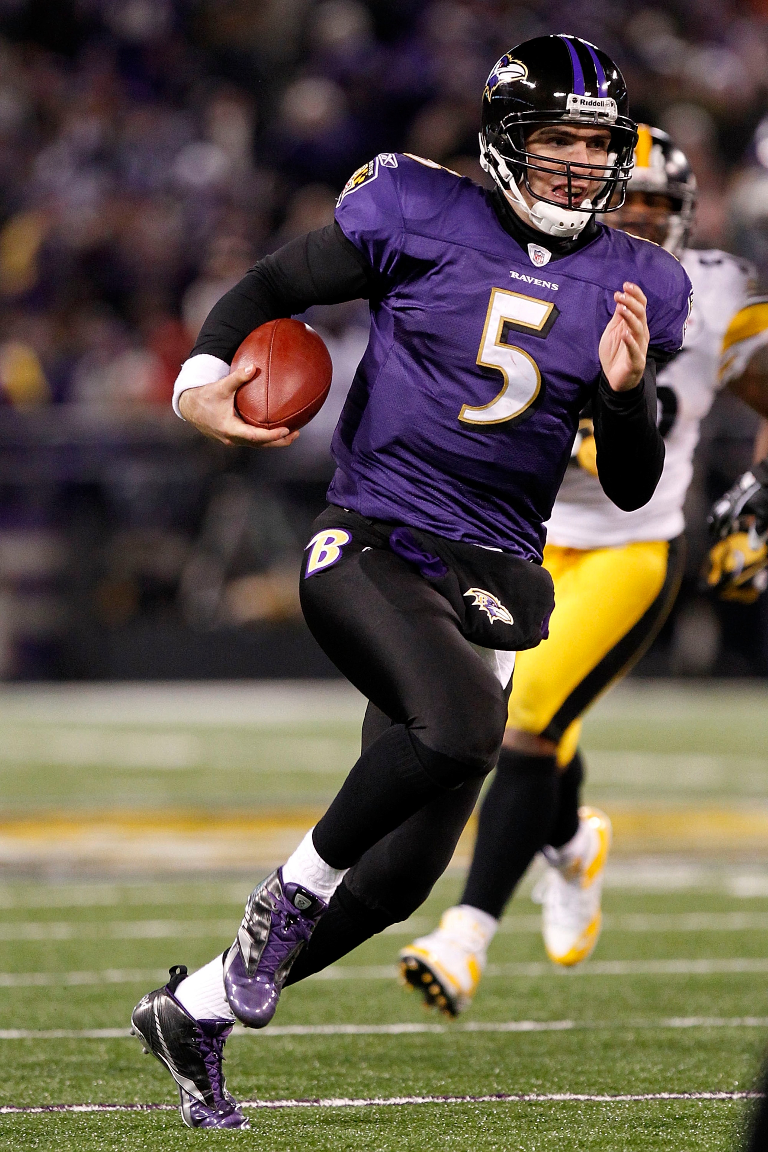 BALTIMORE, MD - DECEMBER 05:  Joe Flacco #5 of the Baltimore Ravens runs with the ball against the Pittsburgh Steelers at M&T Bank Stadium on December 5, 2010 in Baltimore, Maryland.  (Photo by Geoff Burke/Getty Images)