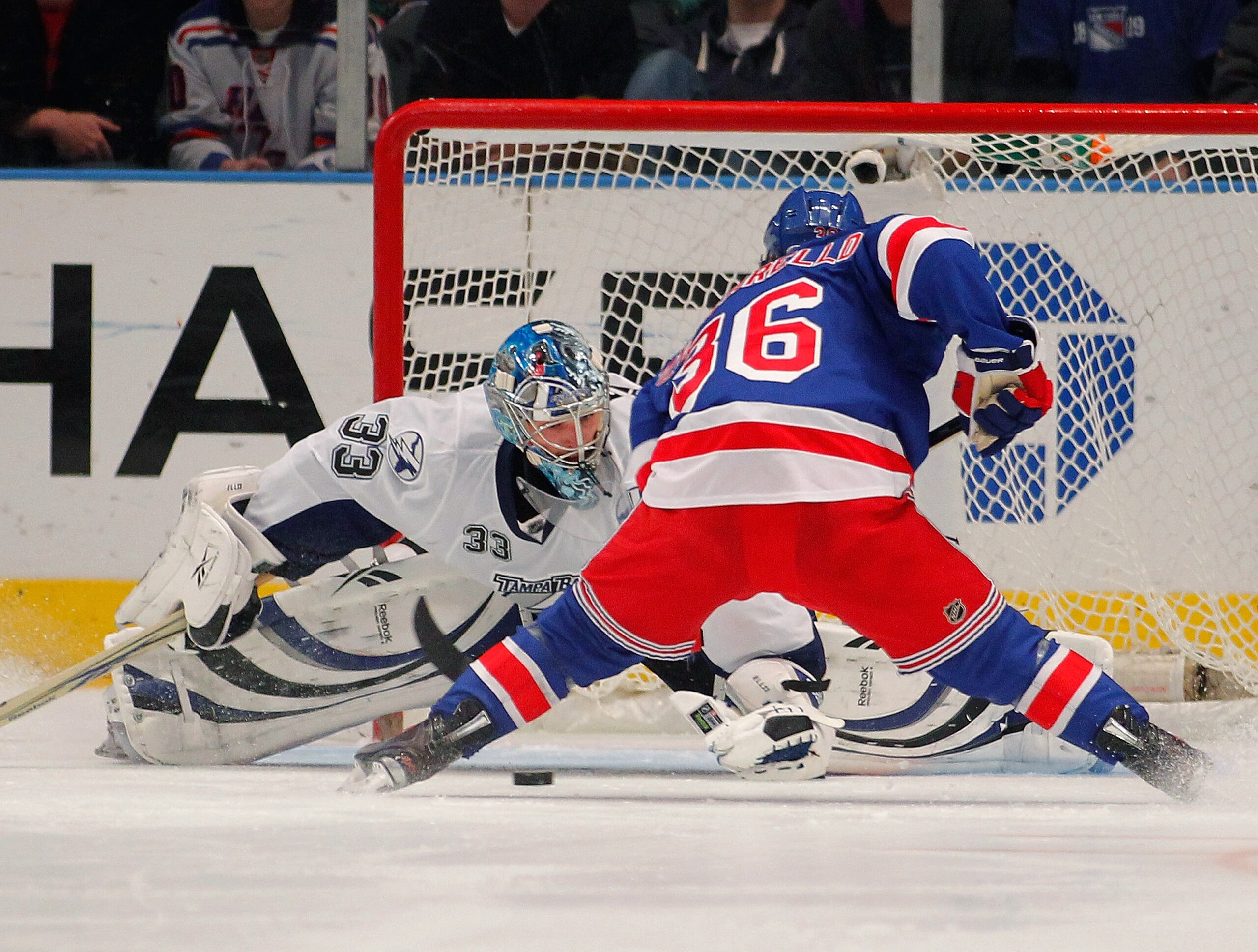 NEW YORK, NY - DECEMBER 23:  Mats Zuccarello #36 of the New York Rangers scores a goal past Dan Ellis #33 of the Tampa Bay Lightning during a shootout in an NHL hockey game at Madison Square Garden on December 23, 2010 in New York City.  (Photo by Paul Be