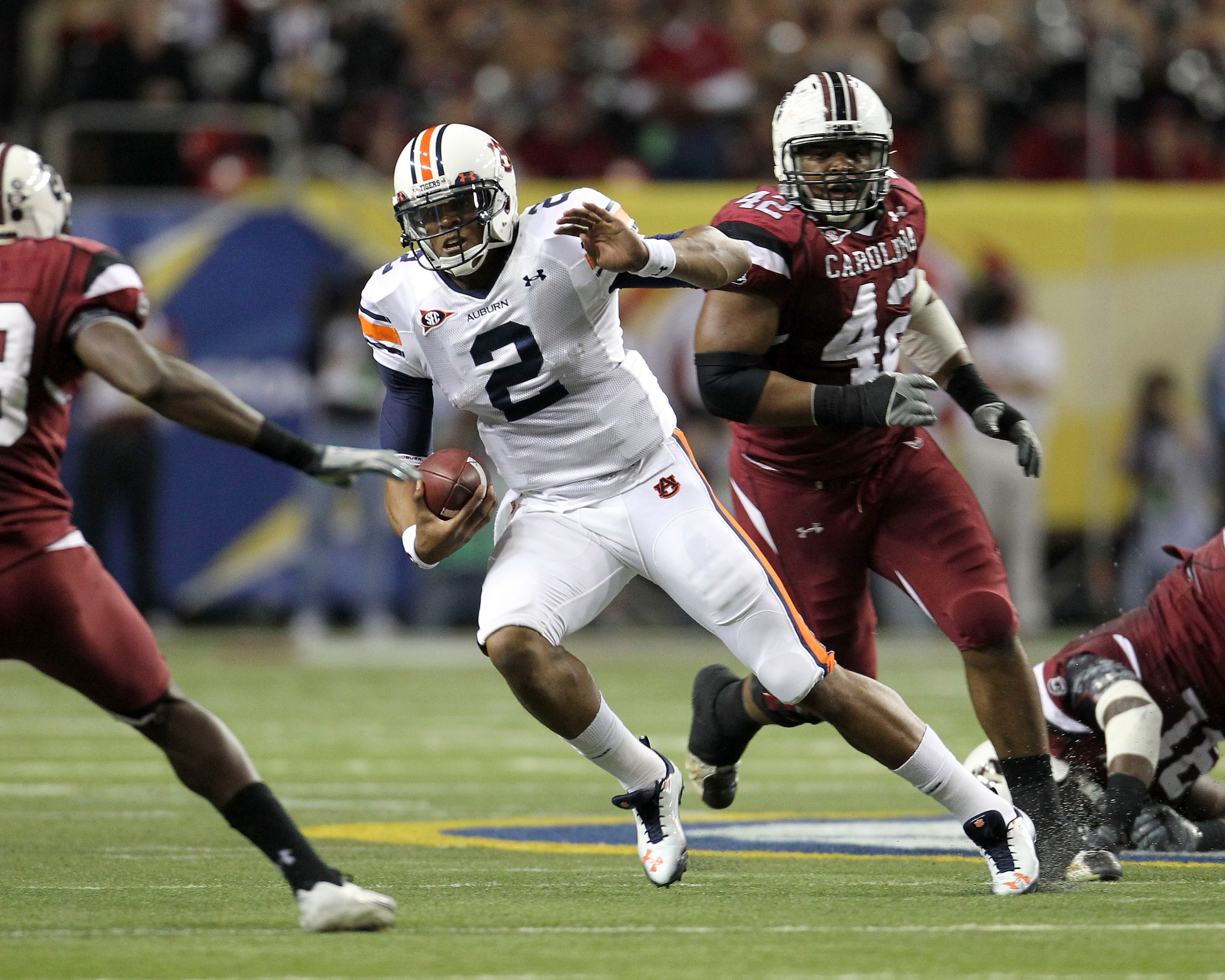 ATLANTA - DECEMBER 04:  Quarterback Cam Newton #2 of the Auburn Tigers runs with the ball during the 2010 SEC Championship against the South Carolina Gamecocks at Georgia Dome on December 4, 2010 in Atlanta, Georgia.  (Photo by Mike Zarrilli/Getty Images)