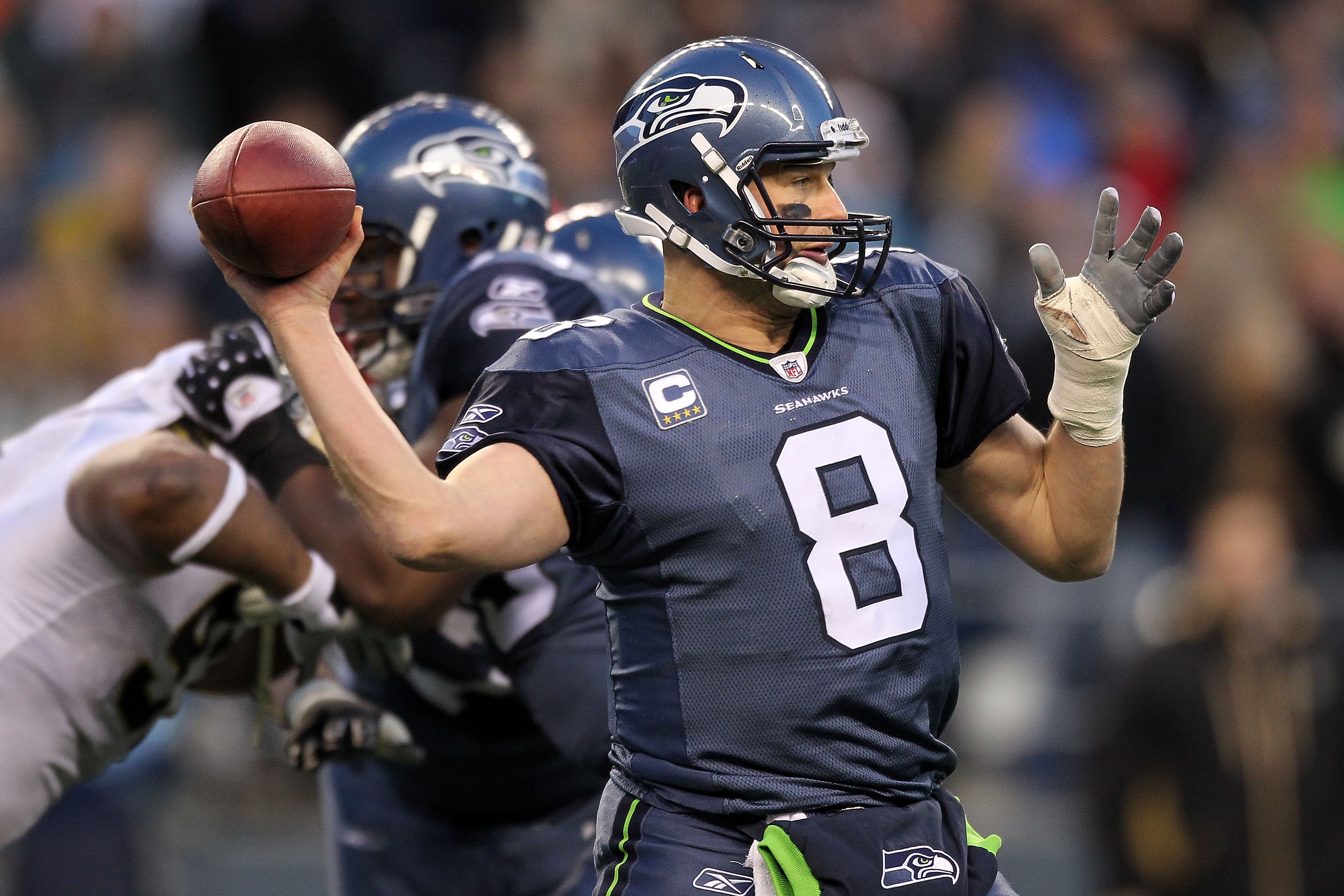 SEATTLE, WA - JANUARY 08:  Quarterback Matt Hasselbeck #8 of the Seattle Seahawks throws the ball in the second half against the New Orleans Saints during the 2011 NFC wild-card playoff game at Qwest Field on January 8, 2011 in Seattle, Washington.  (Phot