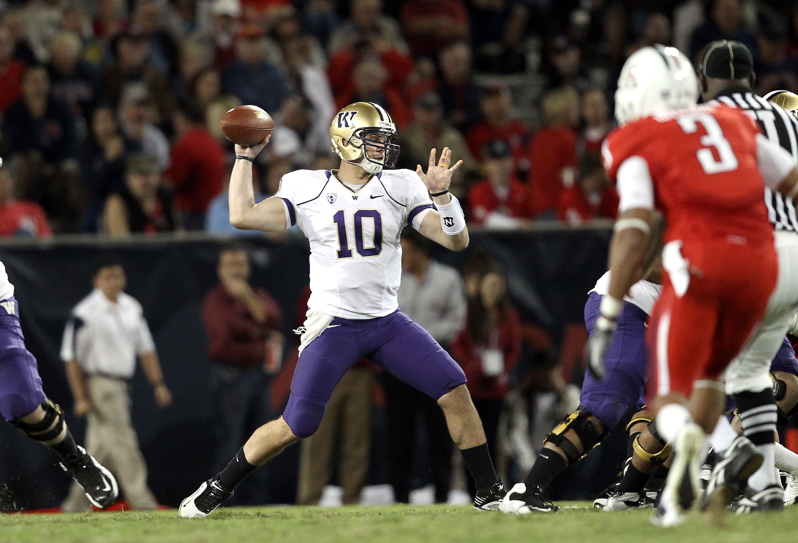 TUCSON, AZ - OCTOBER 23:  Quarterback Jake Locker #10 of the Washington Huskies drops back to pass during the college football game against the Arizona Wildcats at Arizona Stadium on October 23, 2010 in Tucson, Arizona. The Wildcats defeated the Huskies 4