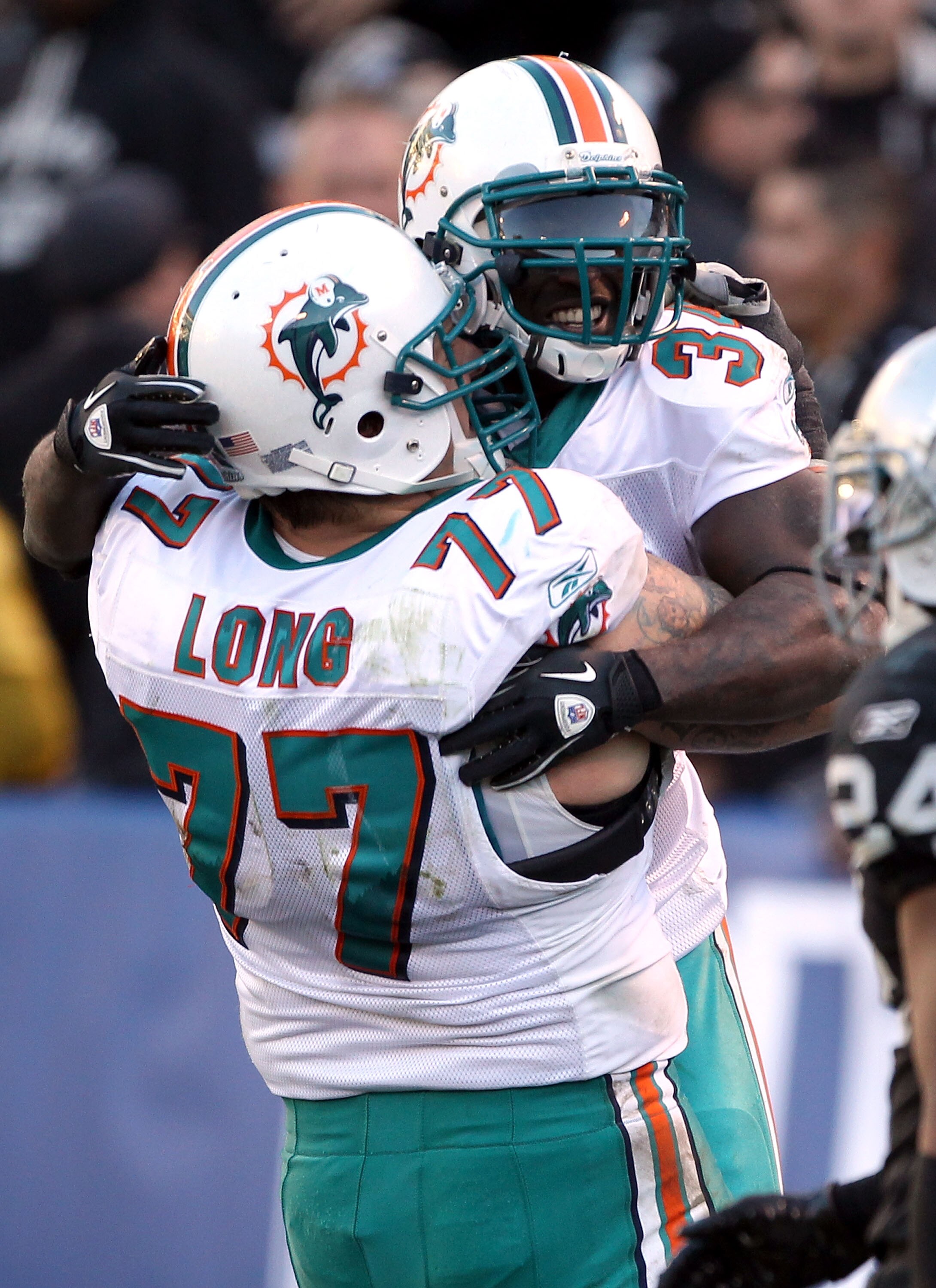 OAKLAND, CA - NOVEMBER 28:  Ricky Williams #34 of the Miami Dolphins celebrates with Jake Long #77 after Williams scored a touchdown during their game against the Oakland Raiders at Oakland-Alameda County Coliseum on November 28, 2010 in Oakland, Californ