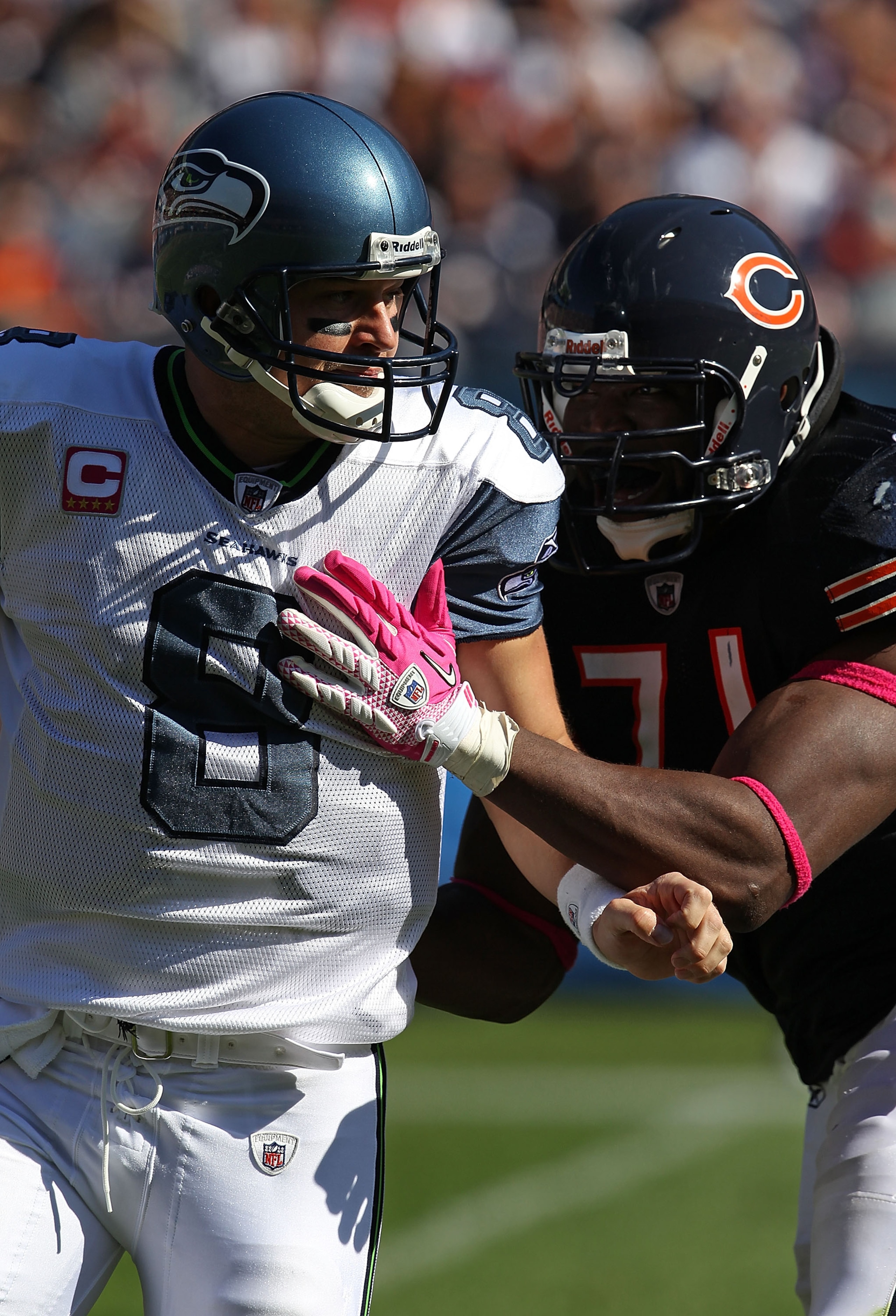 CHICAGO - OCTOBER 17: Israel Idonije #71 of the Chicago Bears hits Matt Hasselbeck #8 of the Seattle Seahawks at Soldier Field on October 17, 2010 in Chicago, Illinois. The Seahawks defeated the Bears 23-20. (Photo by Jonathan Daniel/Getty Images)