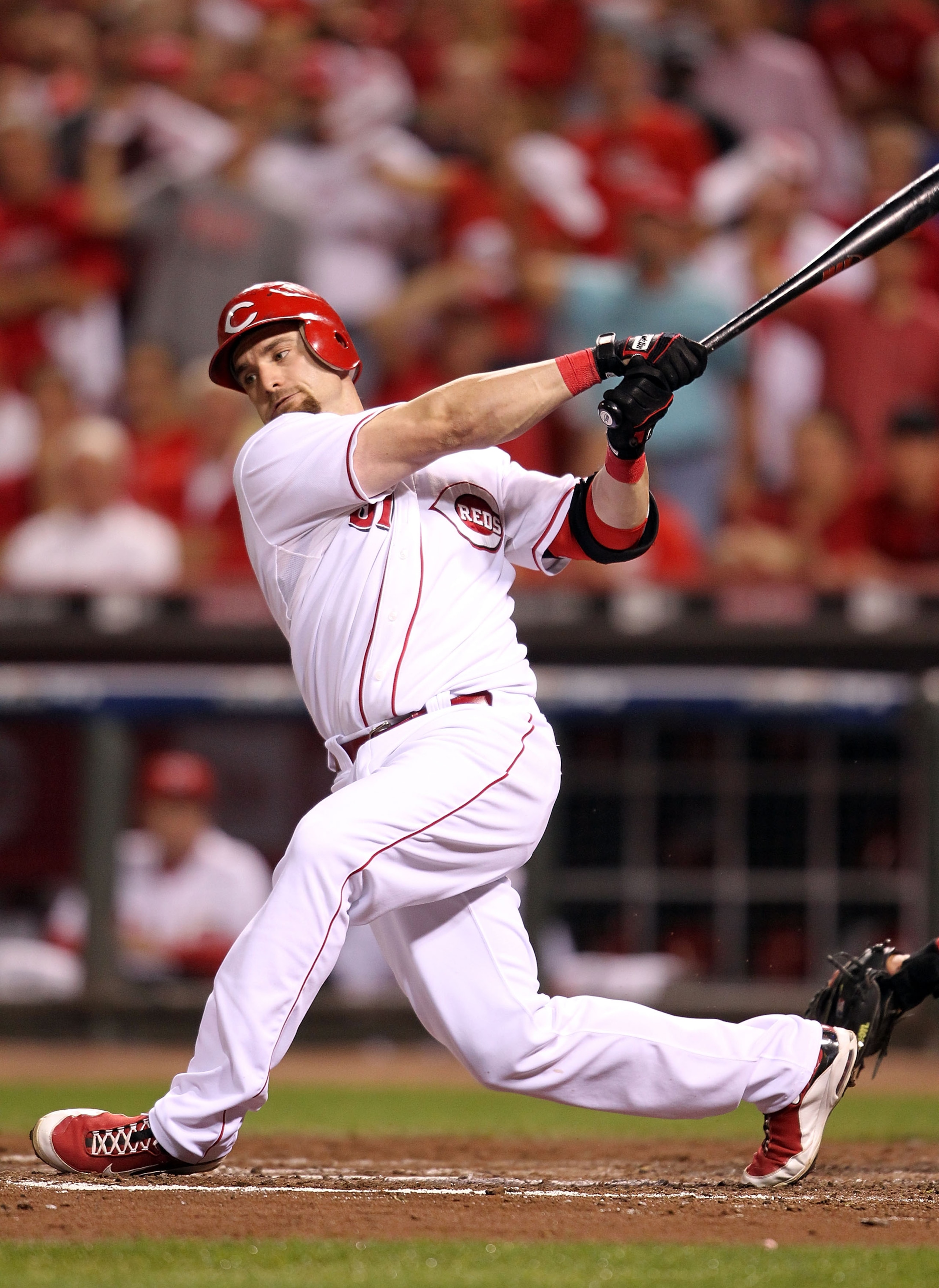 CINCINNATI - OCTOBER 10:  Jonny Gomes #31 of the Cincinnati Reds strikes out against the Philadelphia Phillies  during Game 3 of the NLDS at Great American Ball Park on October 10, 2010 in Cincinnati, Ohio.  (Photo by Andy Lyons/Getty Images)