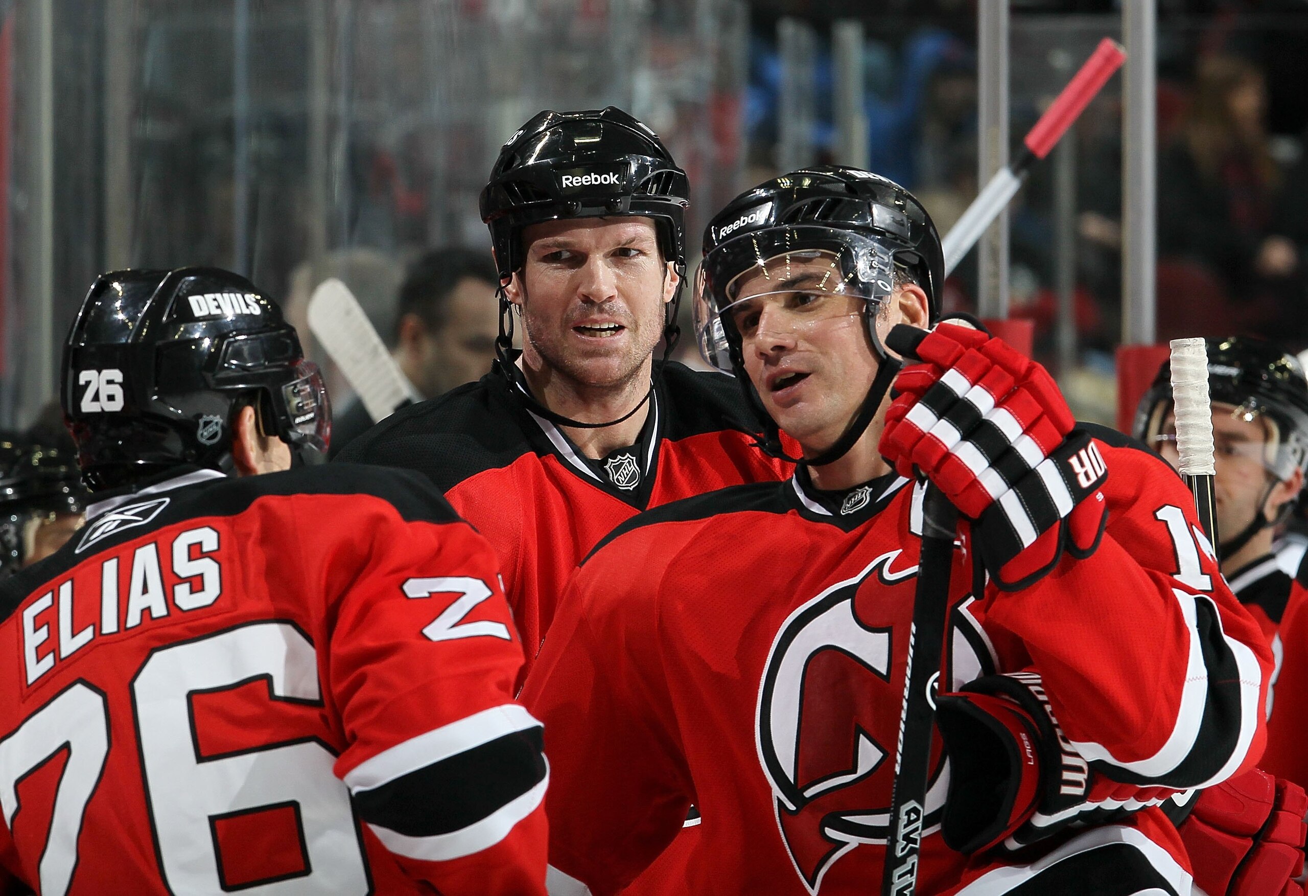 NEWARK, NJ - DECEMBER 31: Jamie Langenbrunner #15 of the New Jersey Devils looks on during a timeout against of the Atlanta Thrashers with teammates Patrik Elias #26 and Jason Arnott #25 at the Prudential Center on December 31, 2010 in Newark, New Jersey NEWARK, NJ - DECEMBER 31: Jamie Langenbrunner #15 of the New Jersey Devils looks on during a timeout against of the Atlanta Thrashers with teammates Patrik Elias #26 and Jason Arnott #25 at the Prudential Center on December 31, 2010 in Newark, New Jersey