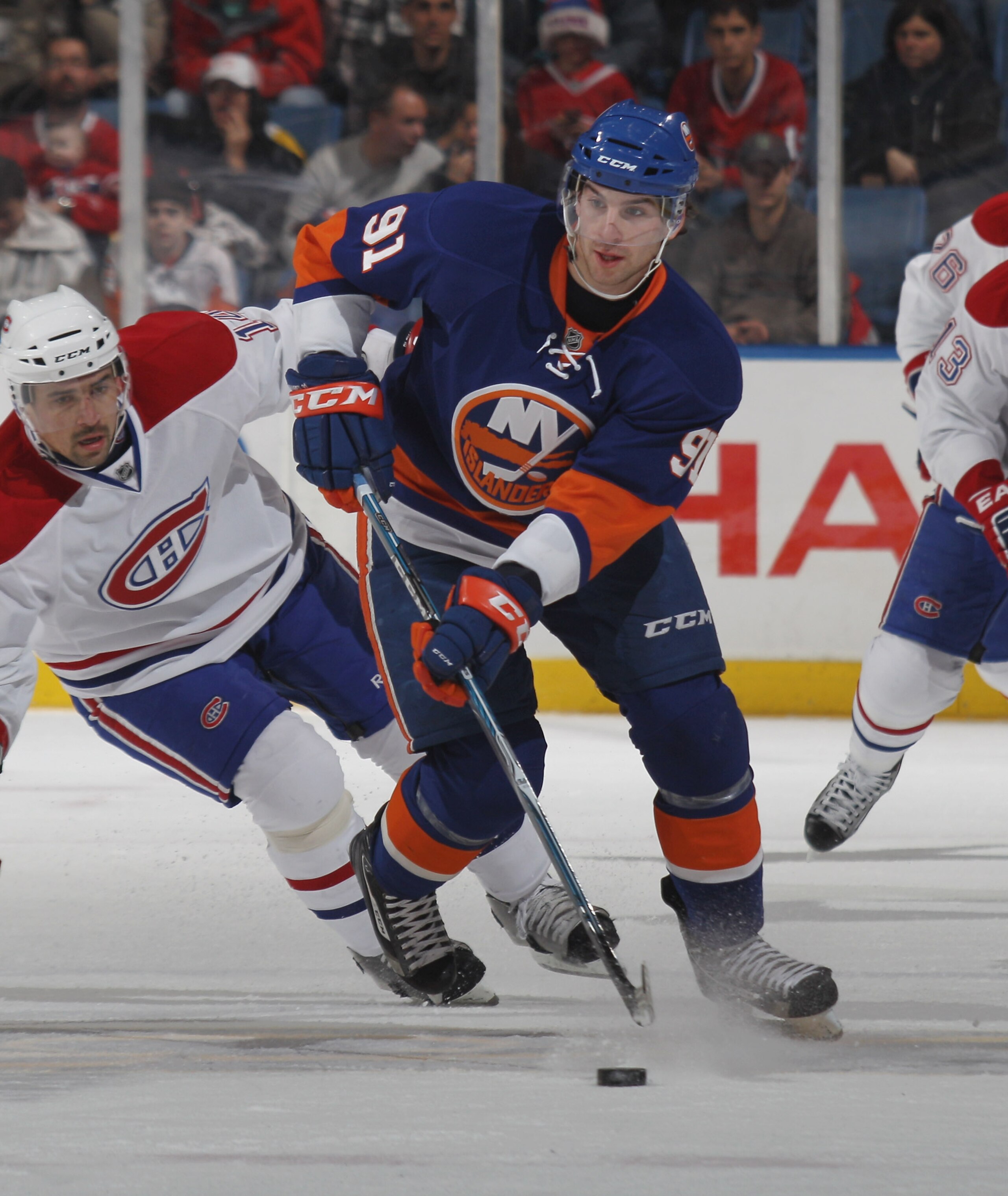 UNIONDALE, NY - DECEMBER 26: John Tavares #91 of the New York Islanders skates against the Montreal Canadiens at the Nassau Coliseum on December 26, 2010 in Uniondale, New York. The Islanders defeated the Canadiens 4-1. (Photo by Bruce Bennett/Getty Ima UNIONDALE, NY - DECEMBER 26: John Tavares #91 of the New York Islanders skates against the Montreal Canadiens at the Nassau Coliseum on December 26, 2010 in Uniondale, New York. The Islanders defeated the Canadiens 4-1. (Photo by Bruce Bennett/Getty Ima