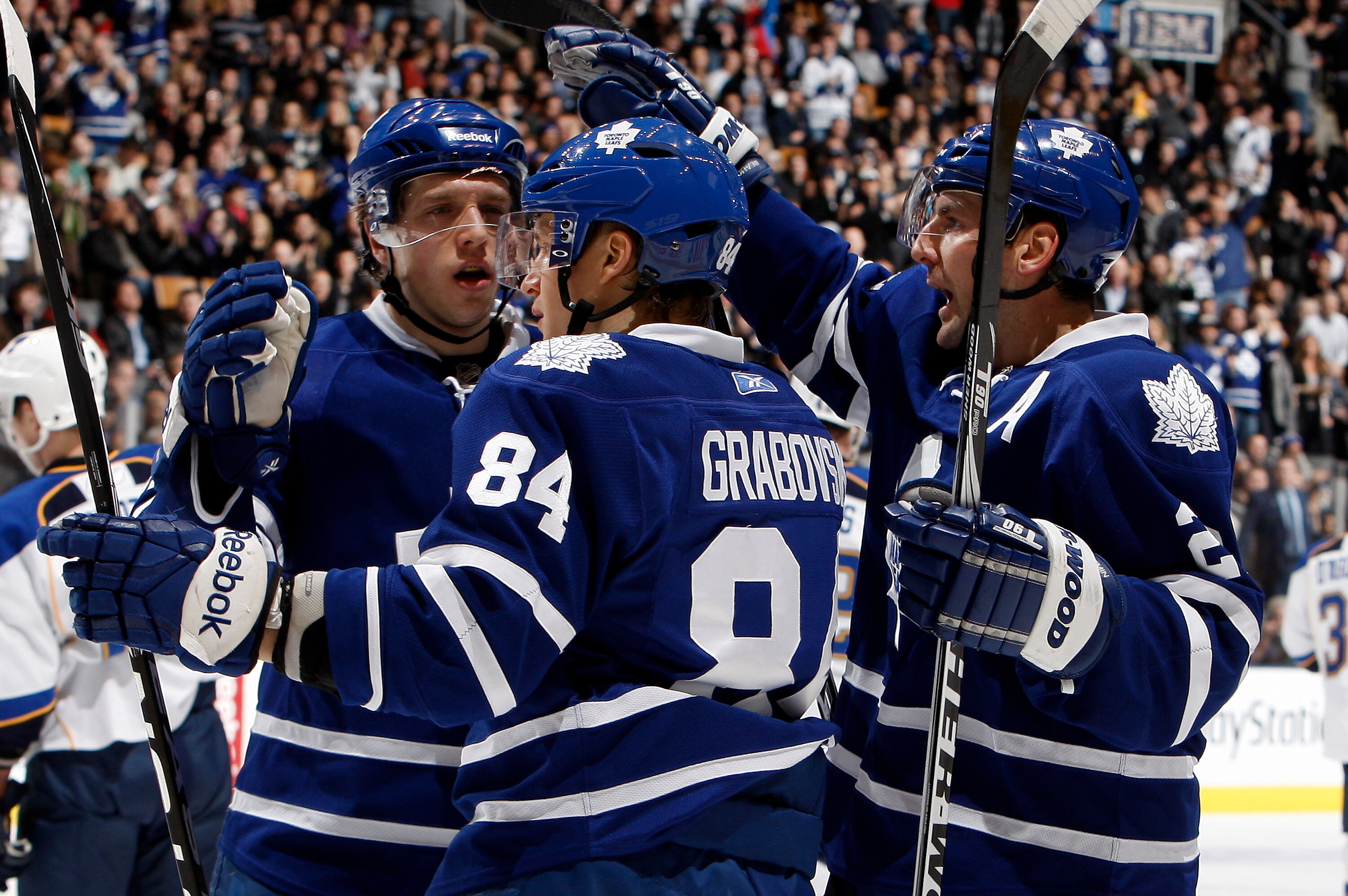 TORONTO, CANADA - JANUARY 6: Nikolai Kulemin #41, Mikhail Grabovski #84 and Francois Beauchemin #22 of the Toronto Maple Leafs celebrate Mikhail Grabovski goal against the St. Louis Blues during game action at the Air Canada Centre January 6, 2011 in Toro