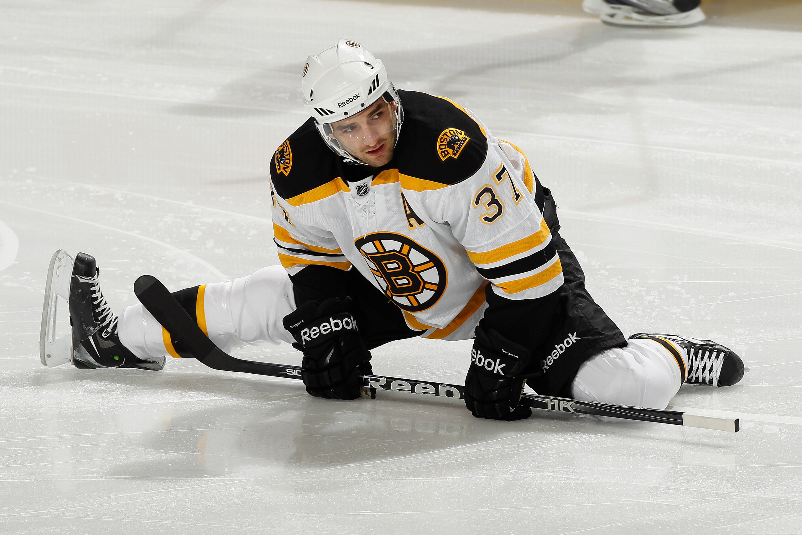 SUNRISE, FL - DECEMBER 27: Patrice Bergeron #37 of the Boston Bruins stretches prior to the game against the Florida Panthers on December 27, 2010 at the BankAtlantic Center in Sunrise, Florida. The Bruins defeated the Panthers 3-2 in a shoot-out. (Photo SUNRISE, FL - DECEMBER 27: Patrice Bergeron #37 of the Boston Bruins stretches prior to the game against the Florida Panthers on December 27, 2010 at the BankAtlantic Center in Sunrise, Florida. The Bruins defeated the Panthers 3-2 in a shoot-out. (Photo