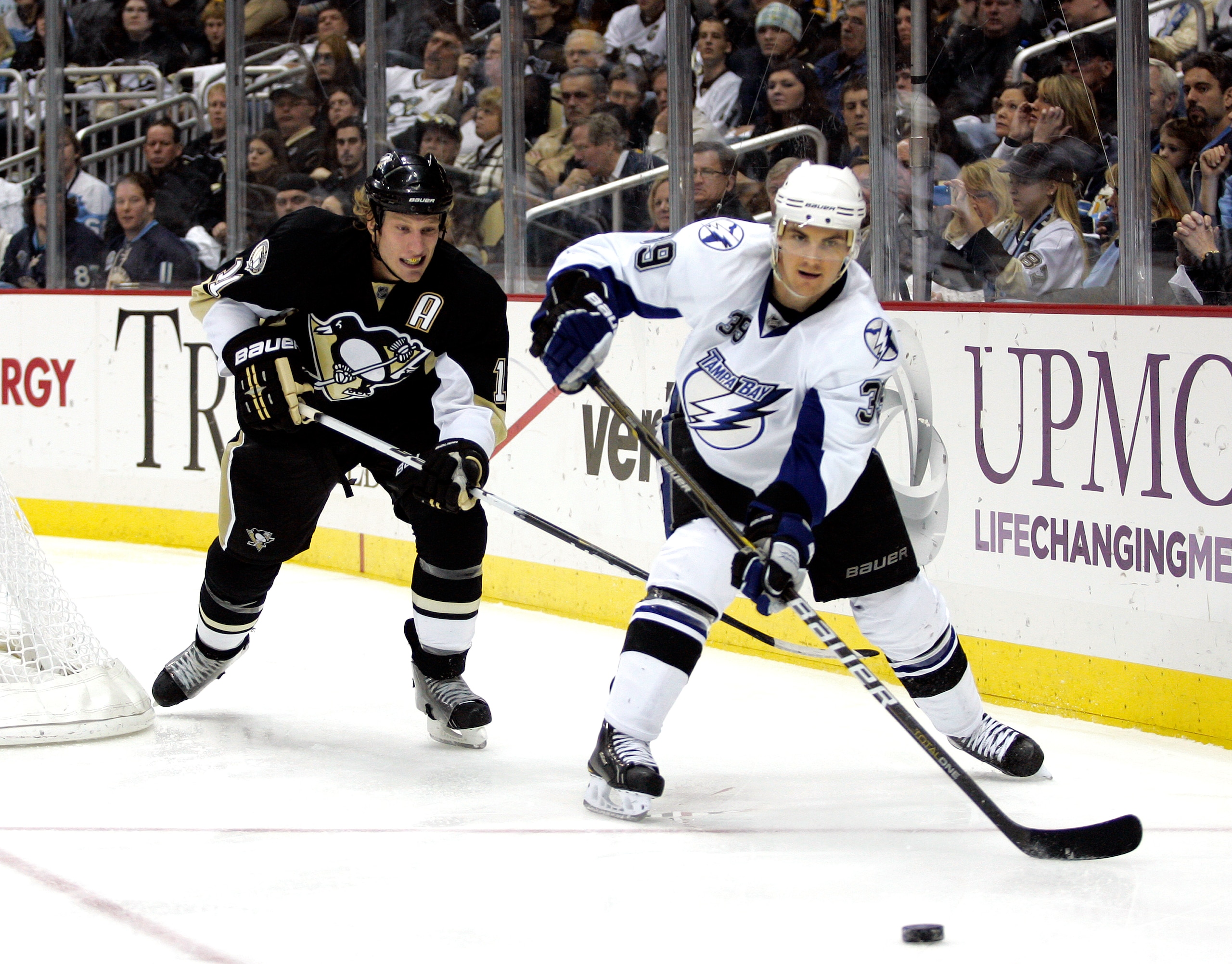 PITTSBURGH, PA - JANUARY 05: Mike Lundin #39 of the Tampa Bay Lightning and Jordan Staal #11 of the Pittsburgh Penguins battle for a puck on January 5, 2011 at Consol Energy Center in Pittsburgh, Pennsylvania. (Photo by Justin K. Aller/Getty Images) PITTSBURGH, PA - JANUARY 05: Mike Lundin #39 of the Tampa Bay Lightning and Jordan Staal #11 of the Pittsburgh Penguins battle for a puck on January 5, 2011 at Consol Energy Center in Pittsburgh, Pennsylvania. (Photo by Justin K. Aller/Getty Images)