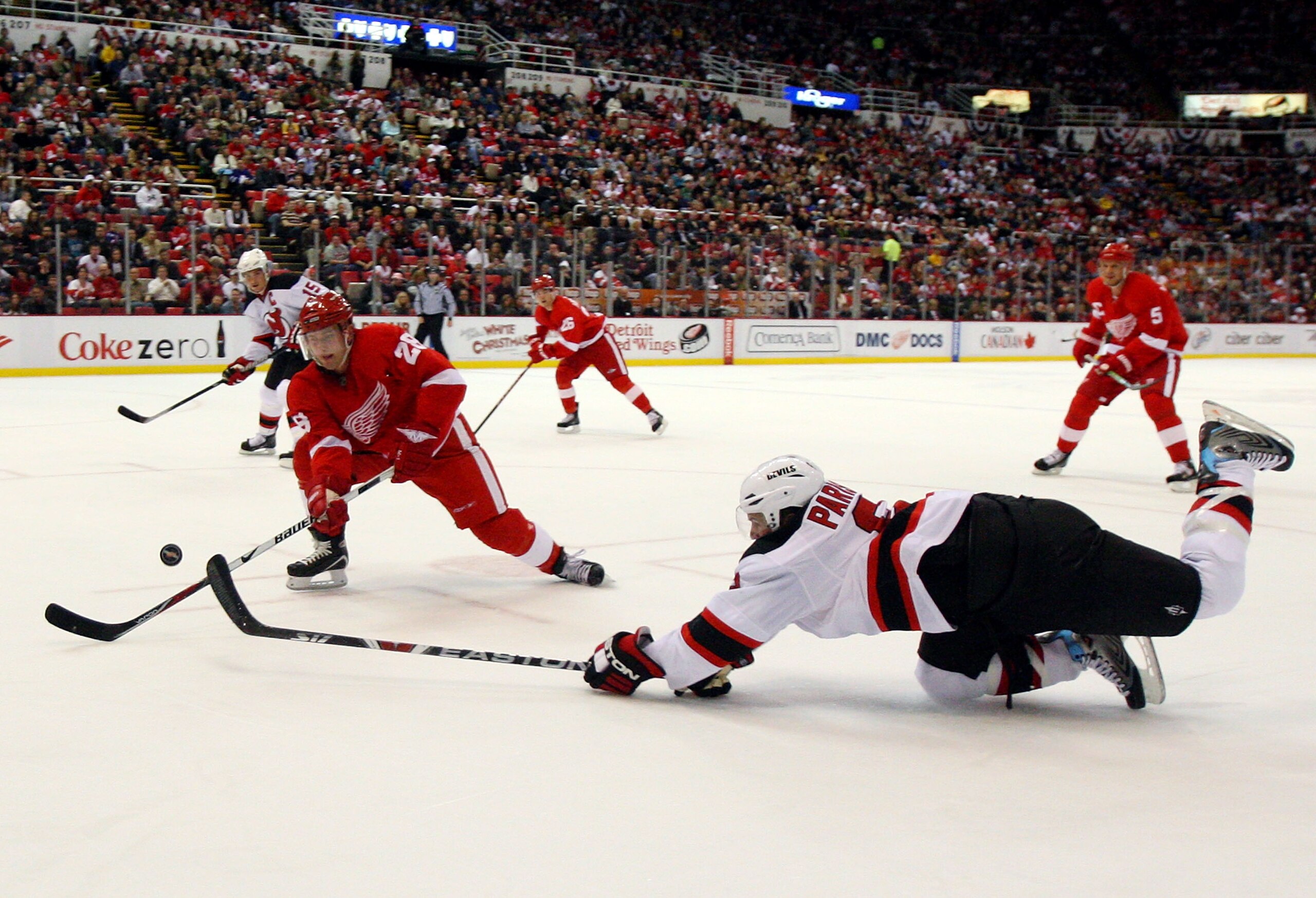 DETROIT - NOVEMBER 08: Brain Rafalski #28 of the Detroit Red Wings defends against Zach Parise #9 of the New Jersey Devils on November 8, 2008 at Joe Louis Arena in Detroit, Michigan. (Photo by Jim McIsaac/Getty Images) DETROIT - NOVEMBER 08: Brain Rafalski #28 of the Detroit Red Wings defends against Zach Parise #9 of the New Jersey Devils on November 8, 2008 at Joe Louis Arena in Detroit, Michigan. (Photo by Jim McIsaac/Getty Images)
