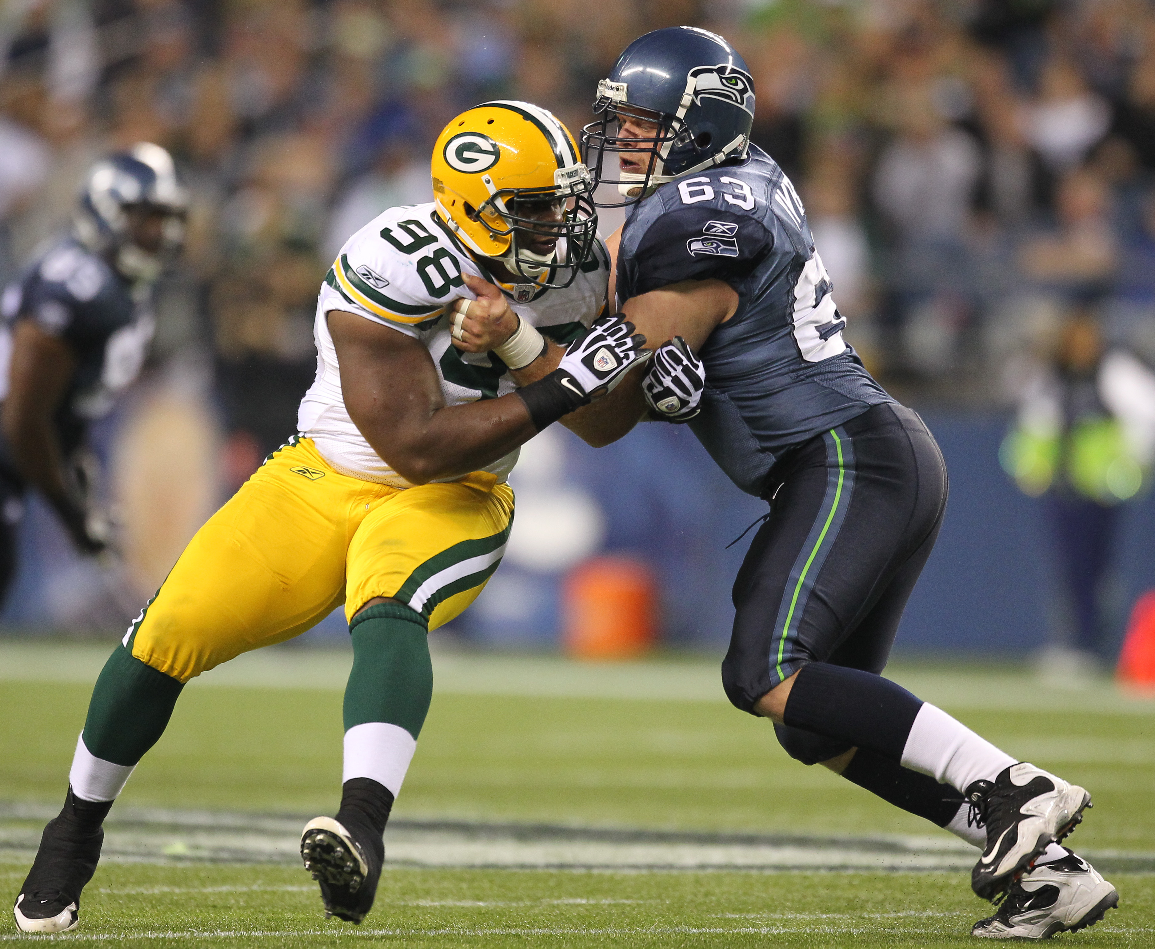 SEATTLE - AUGUST 21:  Defensive end C.J. Wilson #98 of the Green Bay Packers battles Jeff Byers #63 during the preseason game against the Seattle Seahawks at Qwest Field on August 21, 2010 in Seattle, Washington. (Photo by Otto Greule Jr/Getty Images)